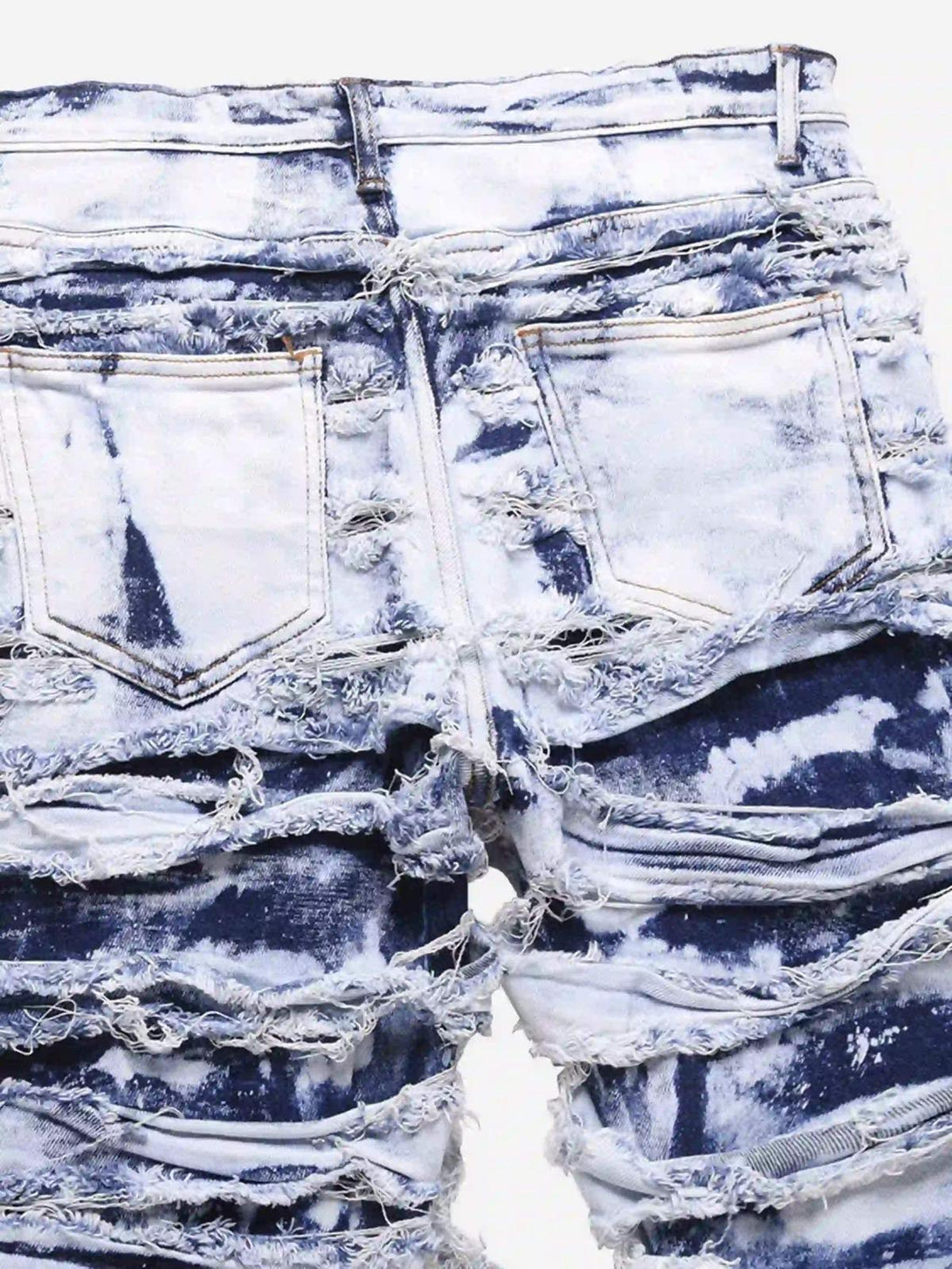 Back view of TALISHKO's distressed jeans, showcasing a bold, rugged texture and edgy style.