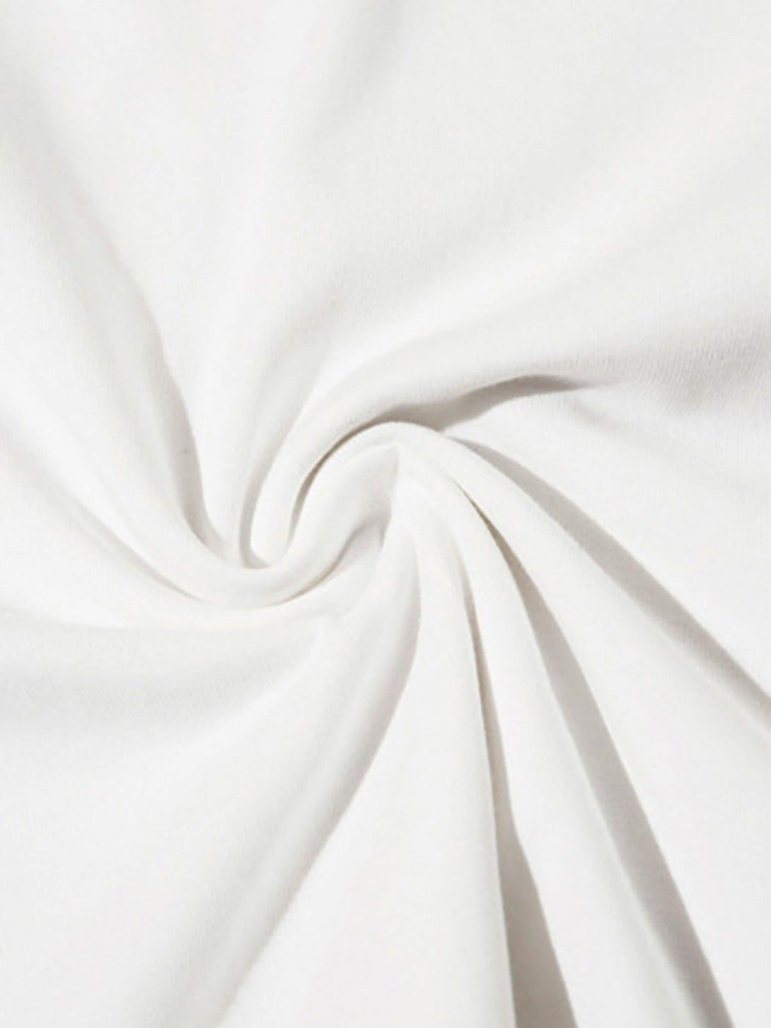 Intricate look at TALISHKO's white fabric texture, showcasing premium quality and softness.