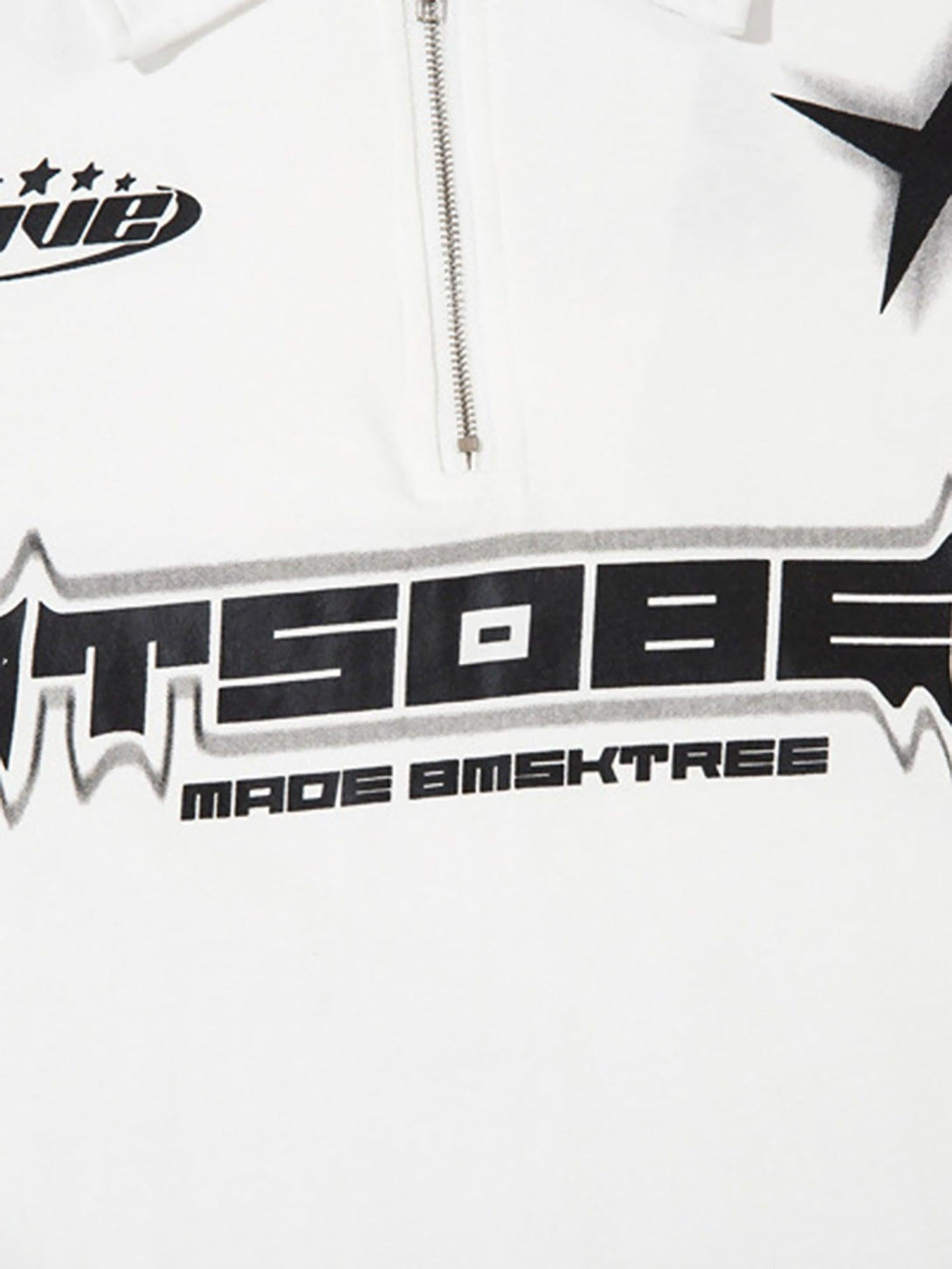 A detailed view of the graphic design on a white TALISHKO long sleeve polo shirt, highlighting bold typography.