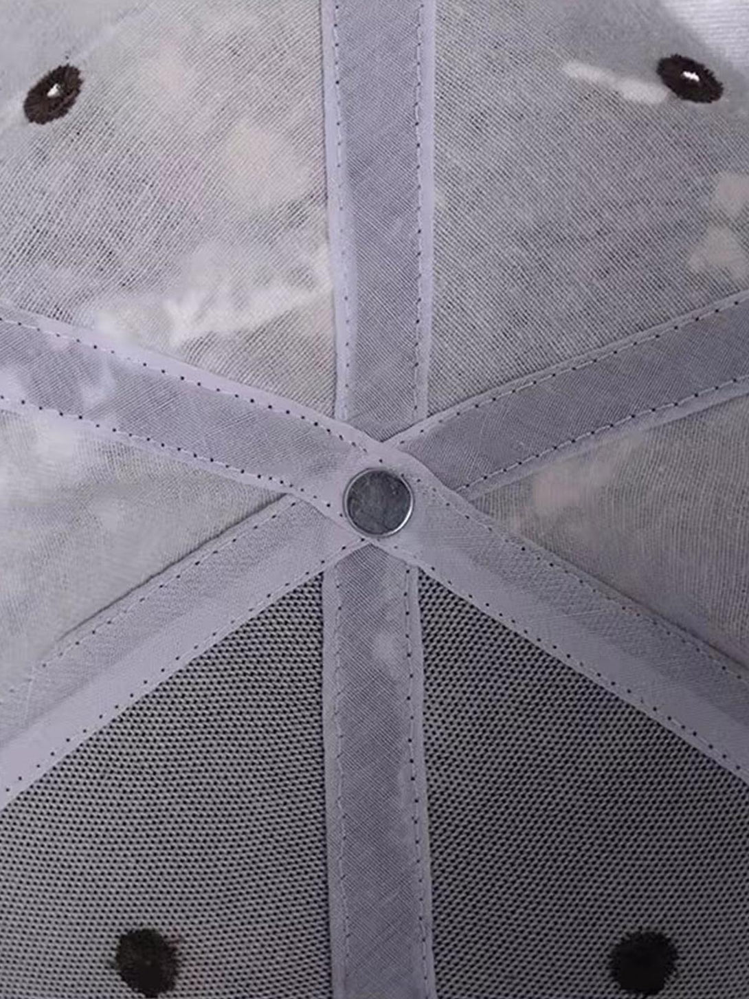 Detailed fabric and stitching inside a camouflage hat by TALISHKO, highlighting quality craftsmanship.