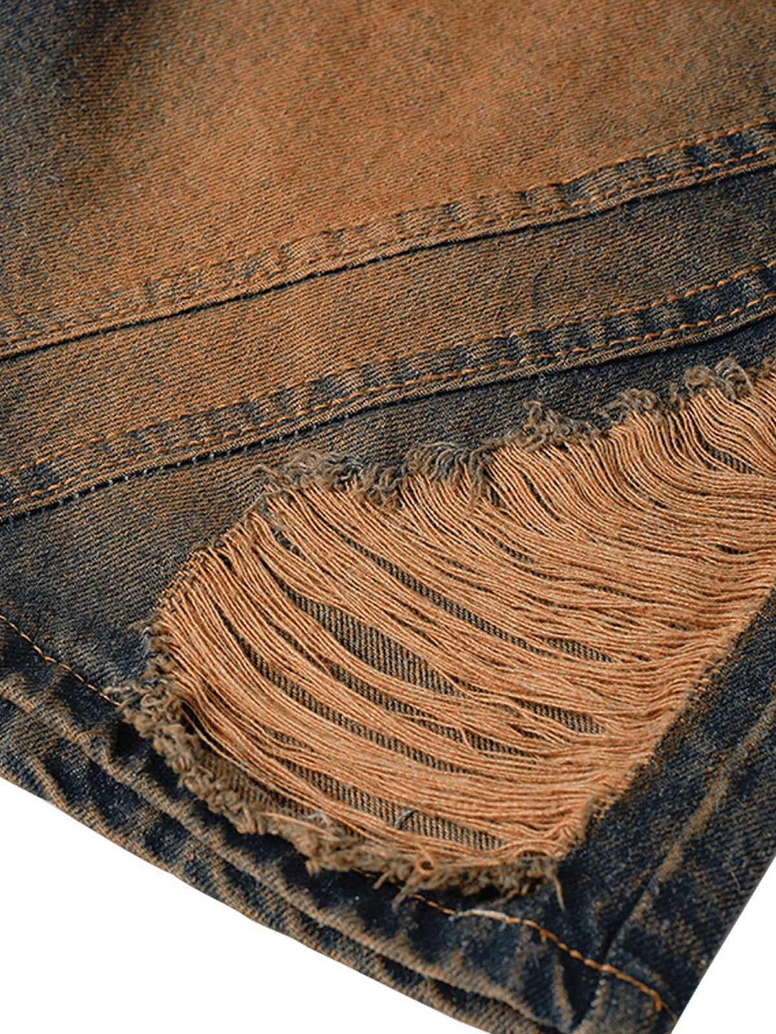 Intricate look at TALISHKO high street denim shorts, highlighting the frayed ripped detail.