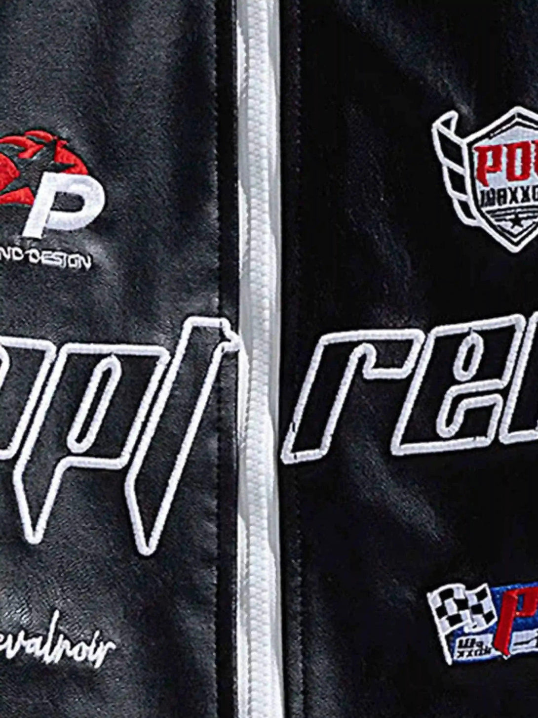 Detailed fabric and stitching of a racing baseball jacket by TALISHKO, showcasing logo patches.