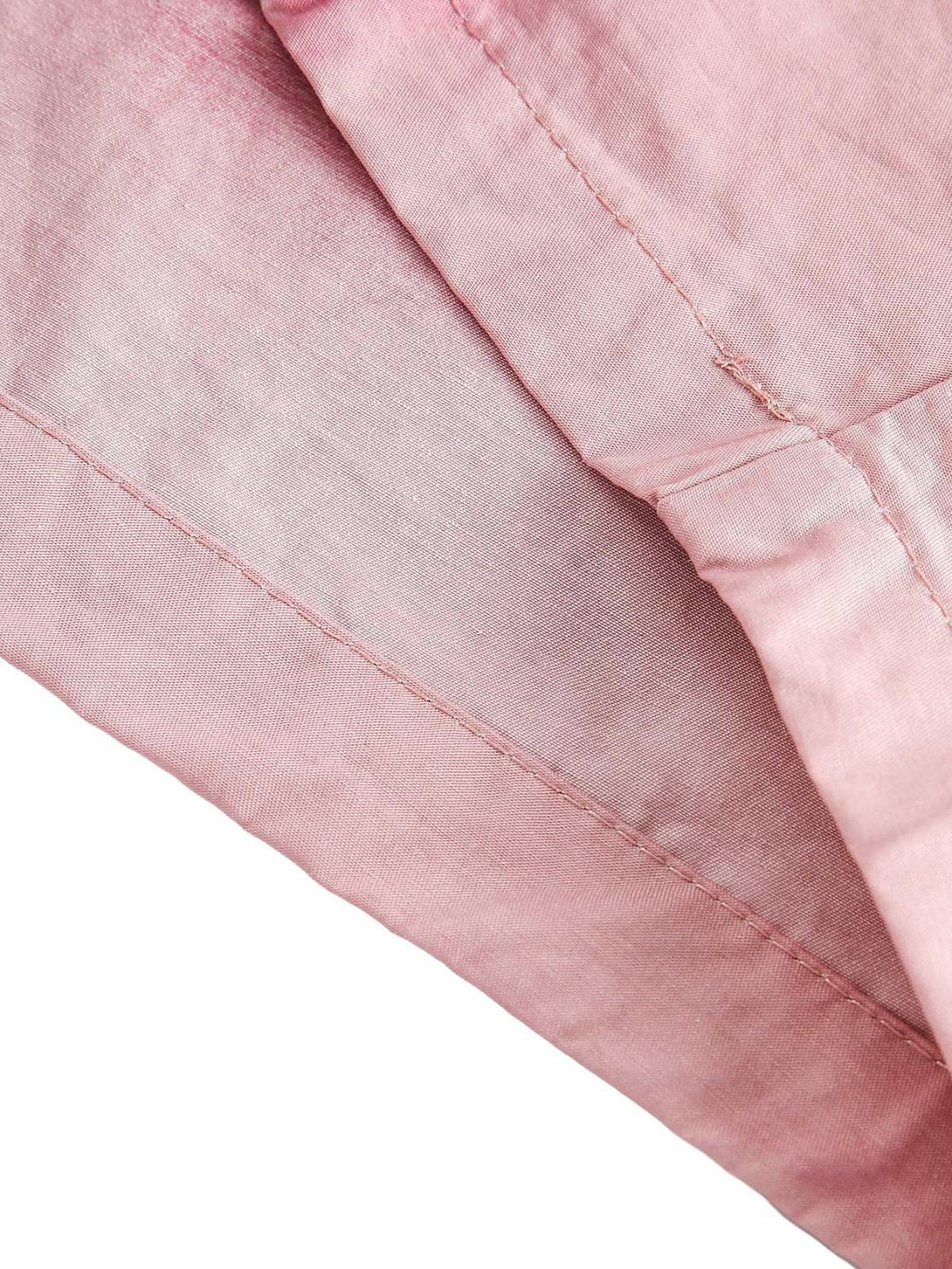 A detailed look at TALISHKO pink casual shorts, showcasing fabric texture and stitching.