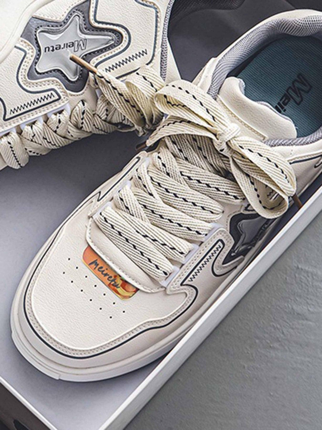 TALISHKO board shoes featuring intricate star detailing and bold laces, ideal for streetwear.