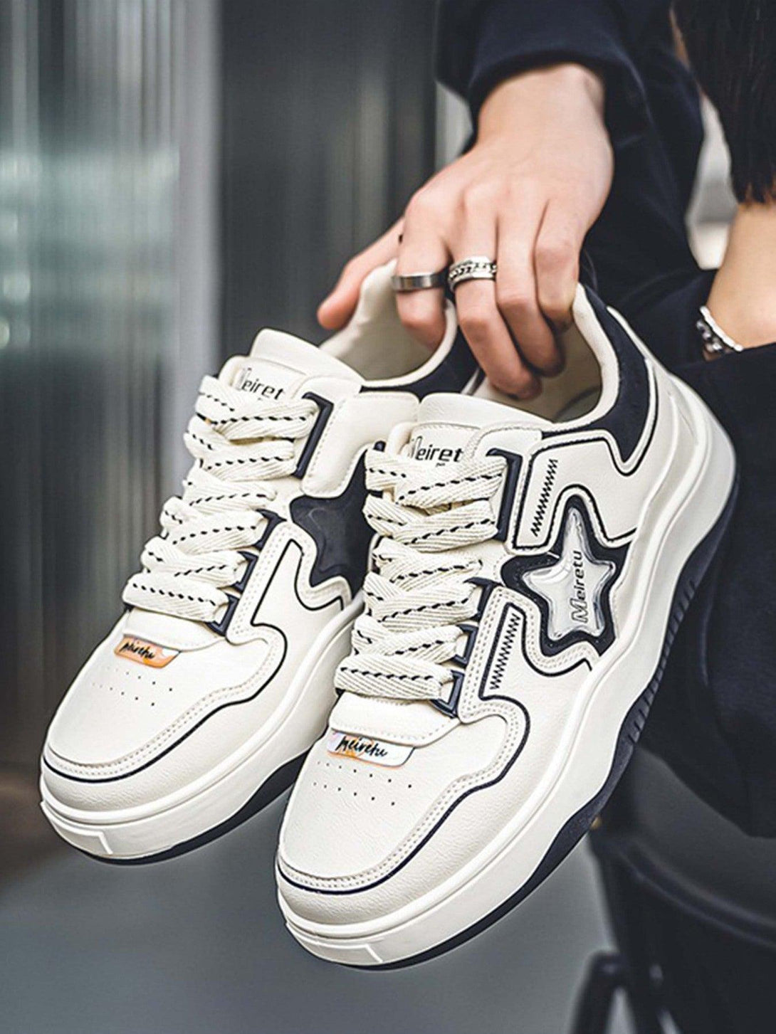 Stylish white TALISHKO board shoes with star detail and a chunky sole, perfect for casual looks.