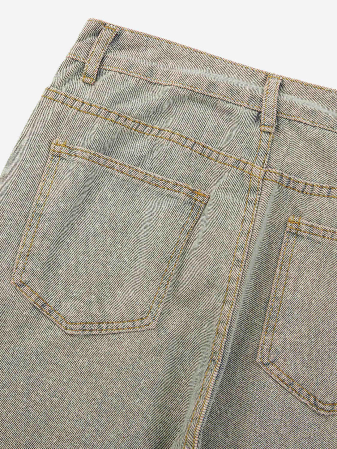 Back view of TALISHKO high street denim jeans highlighting detailed stitching and texture.