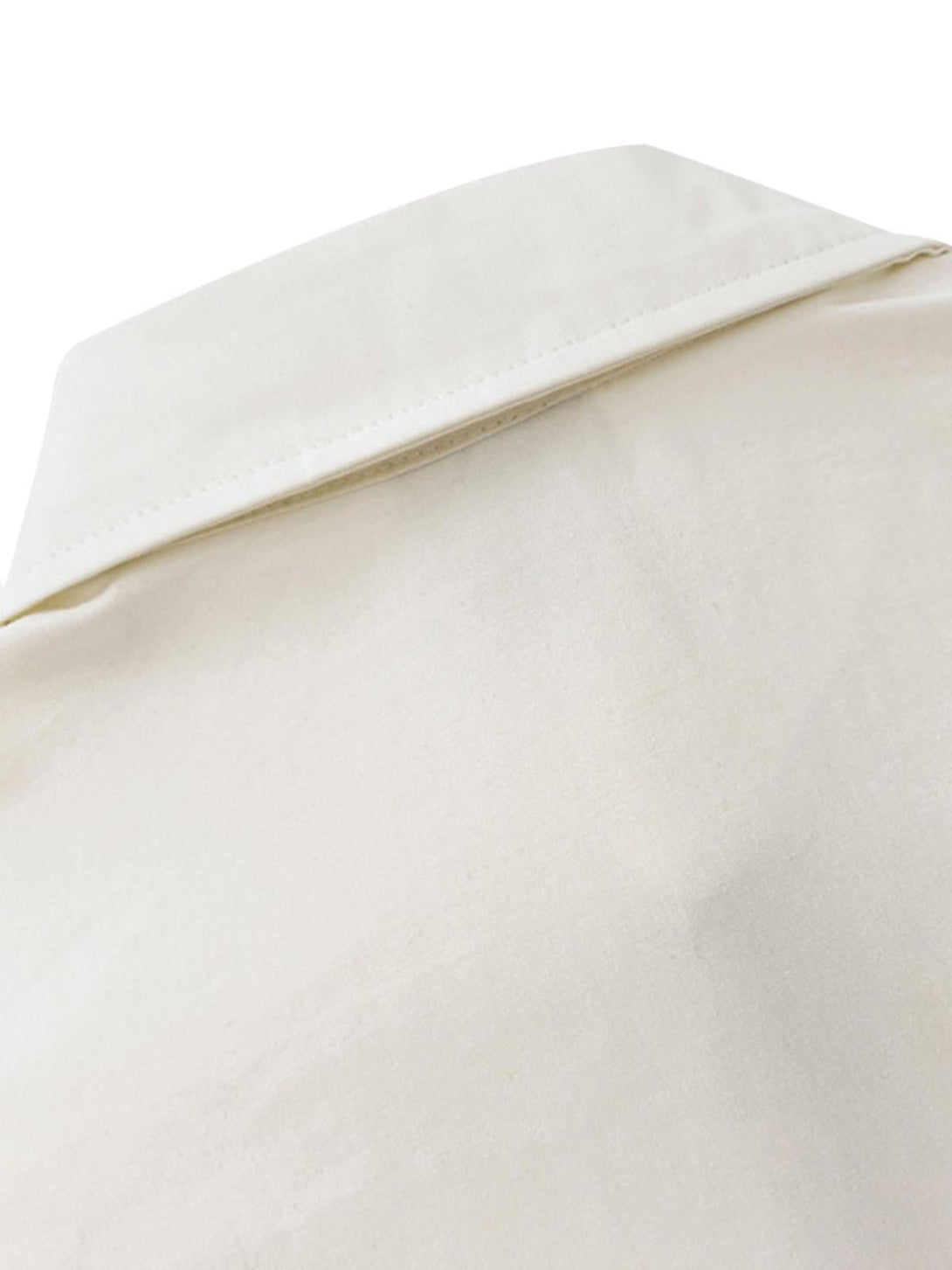A detailed view of TALISHKO's short-sleeved shirt collar, highlighting its sleek design.