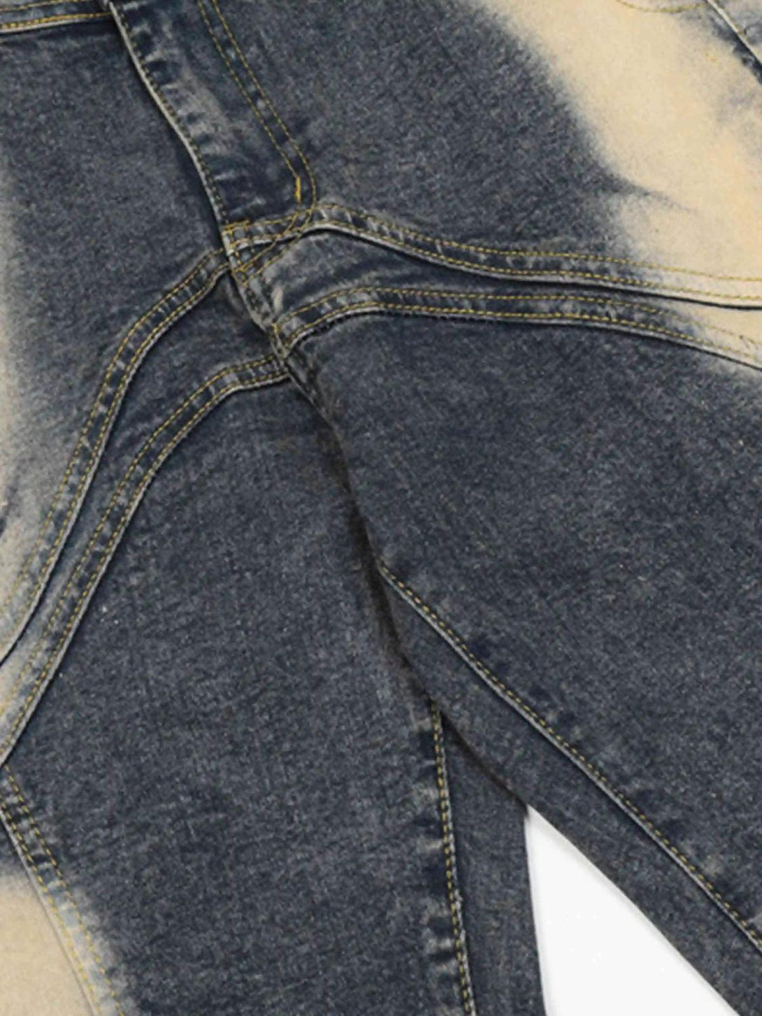 Detailed fabric and stitching of TALISHKO vintage flared jeans, highlighting the bleached texture.