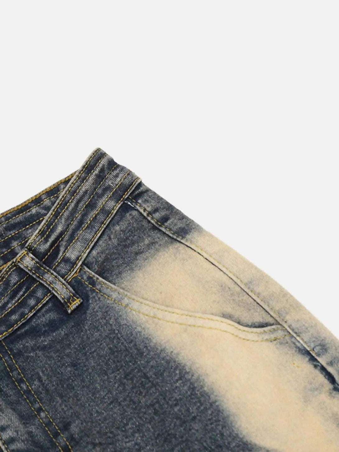 A detailed view of TALISHKO flared jeans, showcasing the unique bleached denim texture.