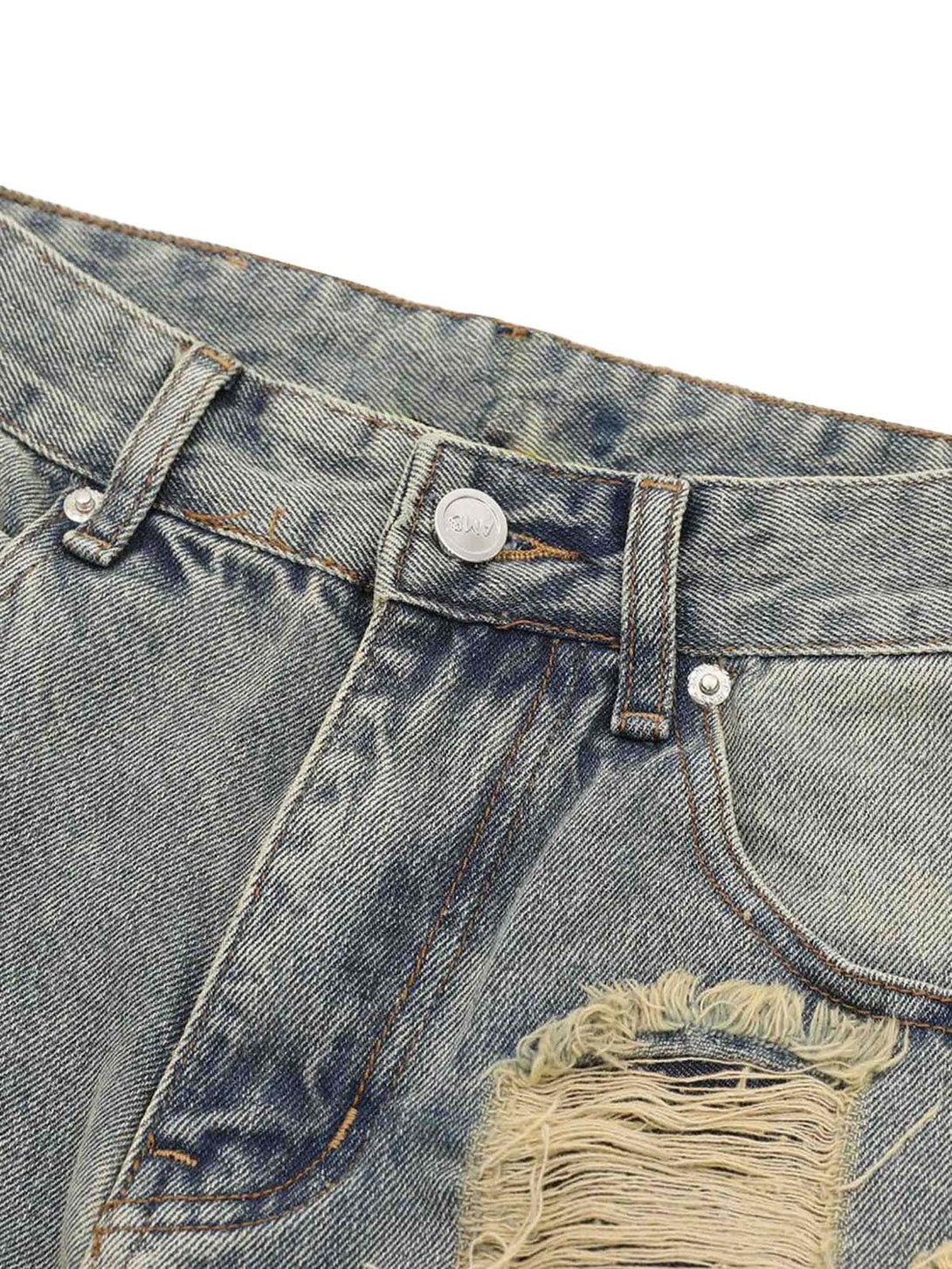 Zoomed-in texture of TALISHKO's denim pants, highlighting distressed details and stitching.