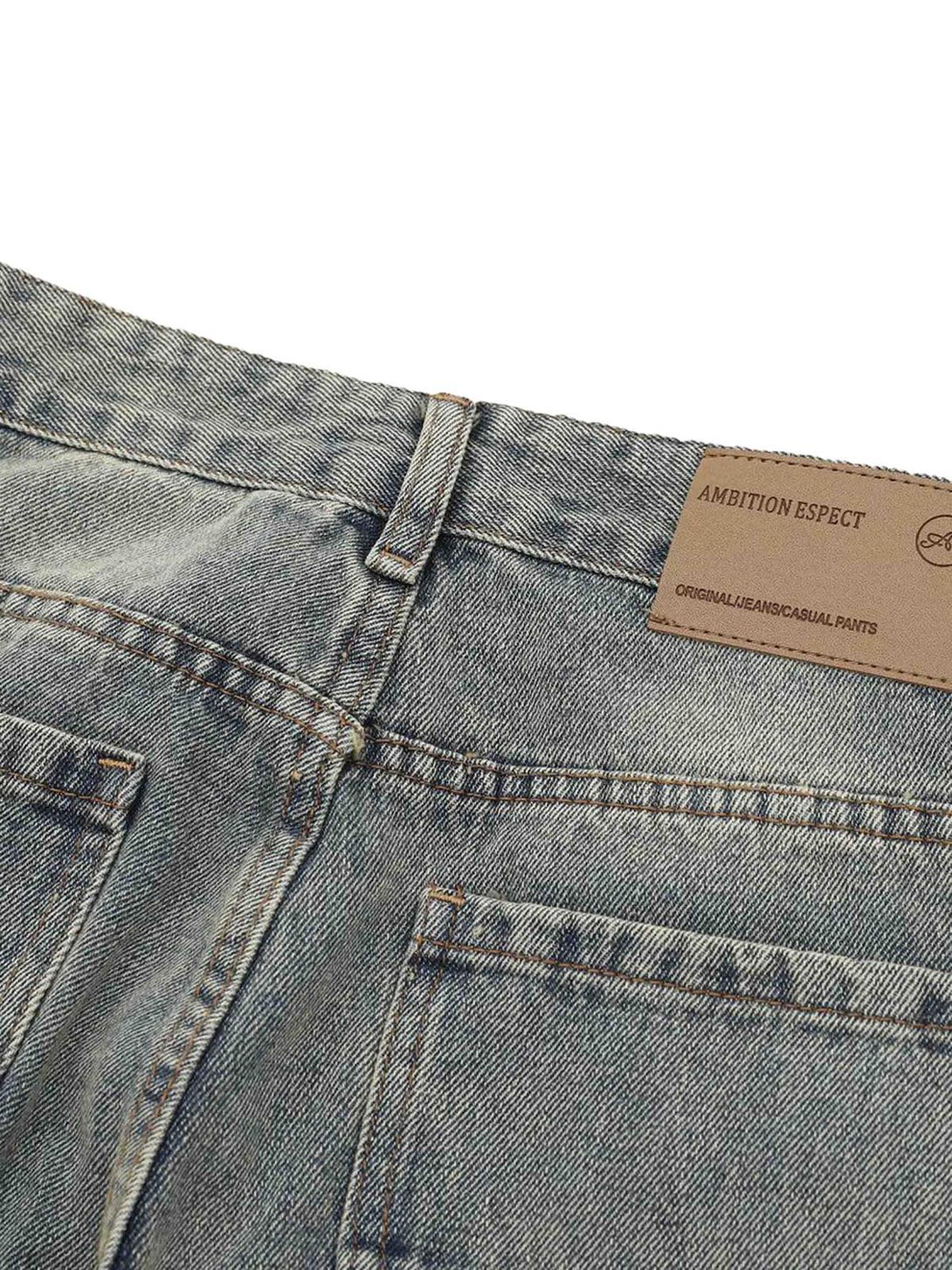 Close-up of TALISHKO denim pants, showcasing back pockets and textured fabric detail.