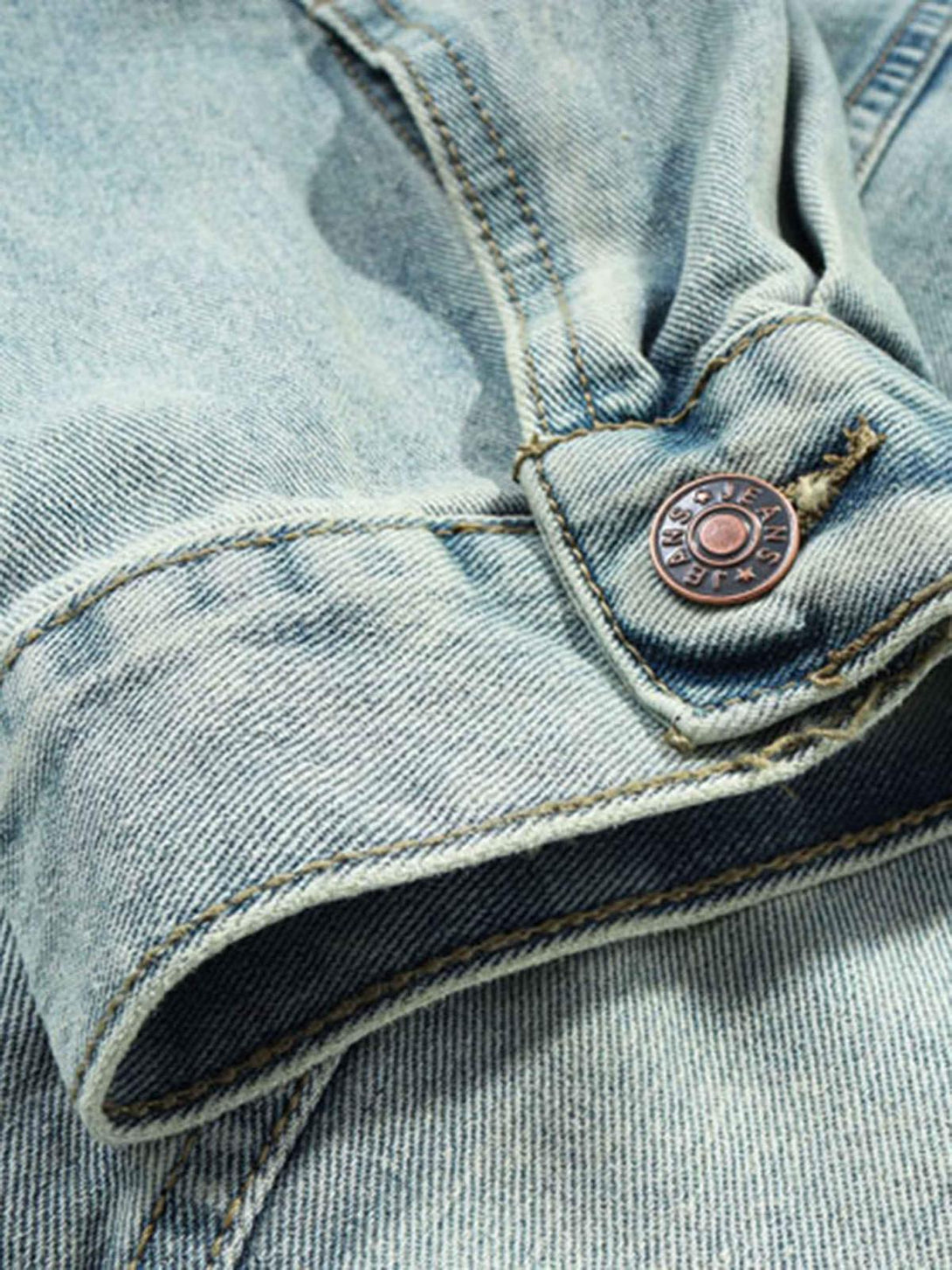 Focusing on the button detail and stitching of TALISHKO's washed denim hoodie.