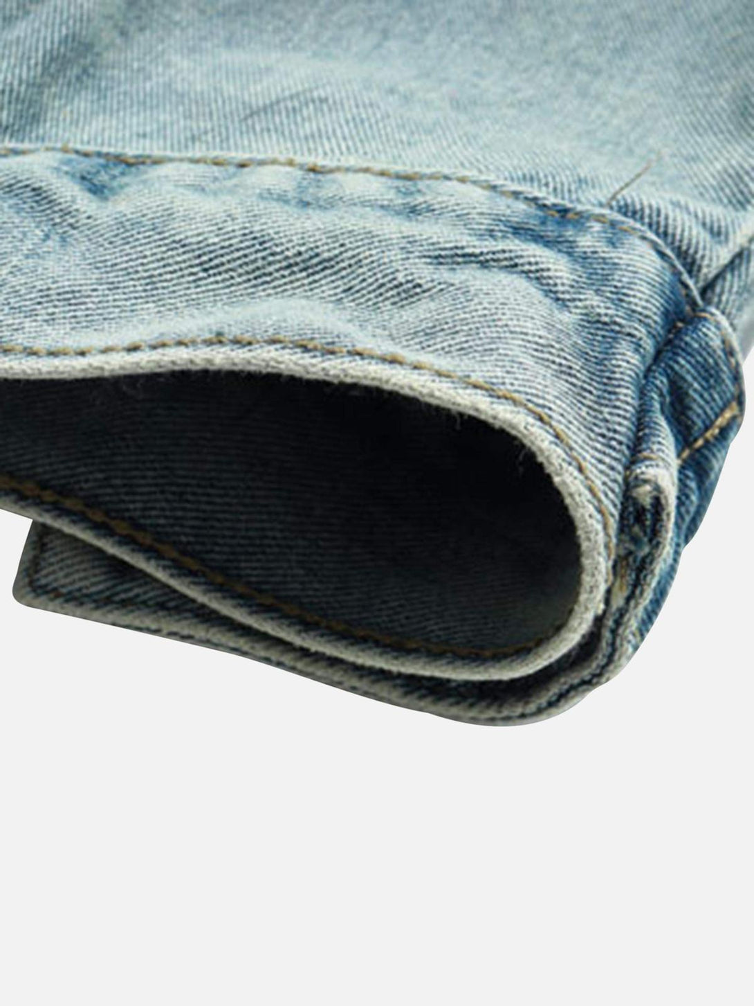 Detailed fabric and stitching on TALISHKO's denim hoodie, highlighting its worn-in style.