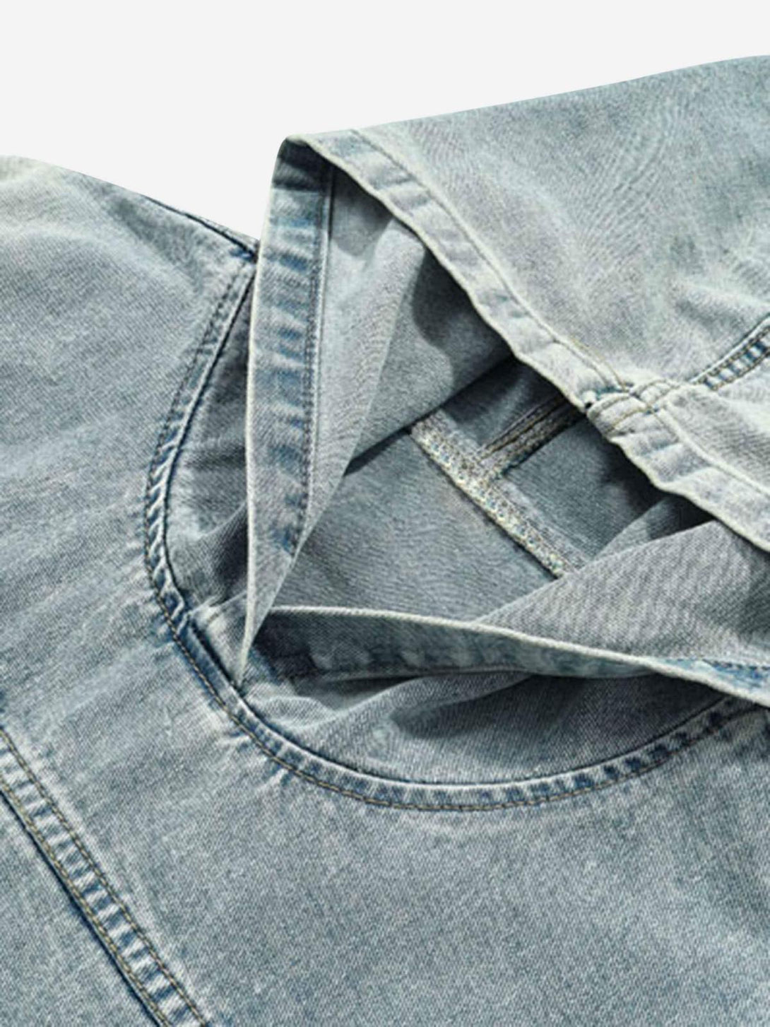 Intricate look at the hood's stitching and texture on TALISHKO's washed denim hoodie.