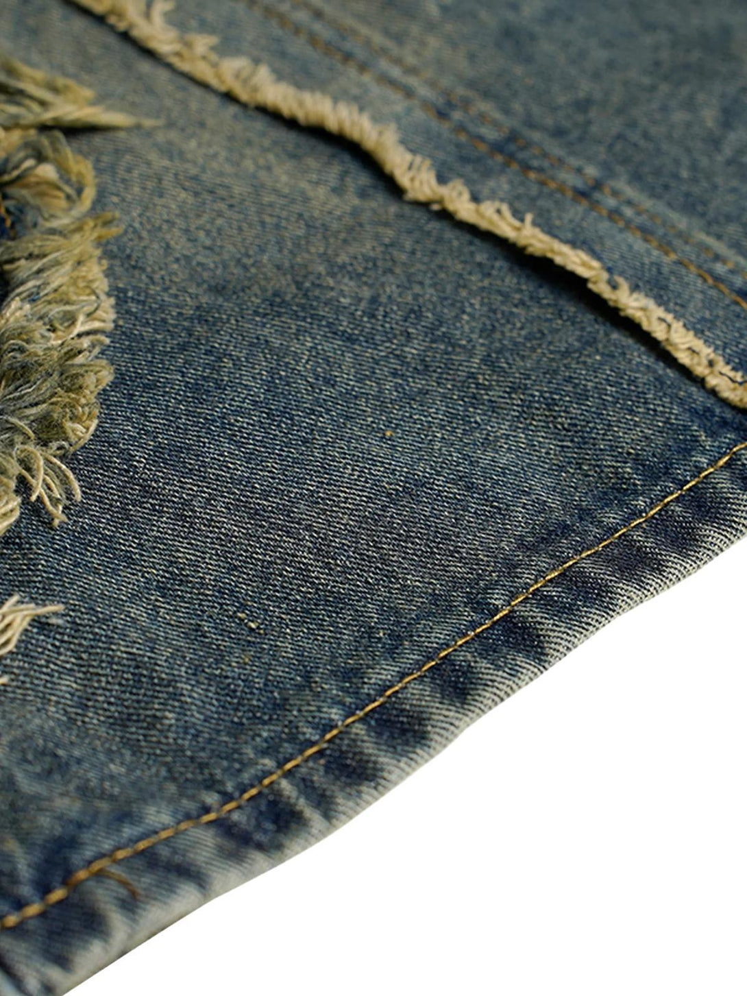 Detailed fabric and stitching of TALISHKO distressed denim shorts, highlighting frayed edges.