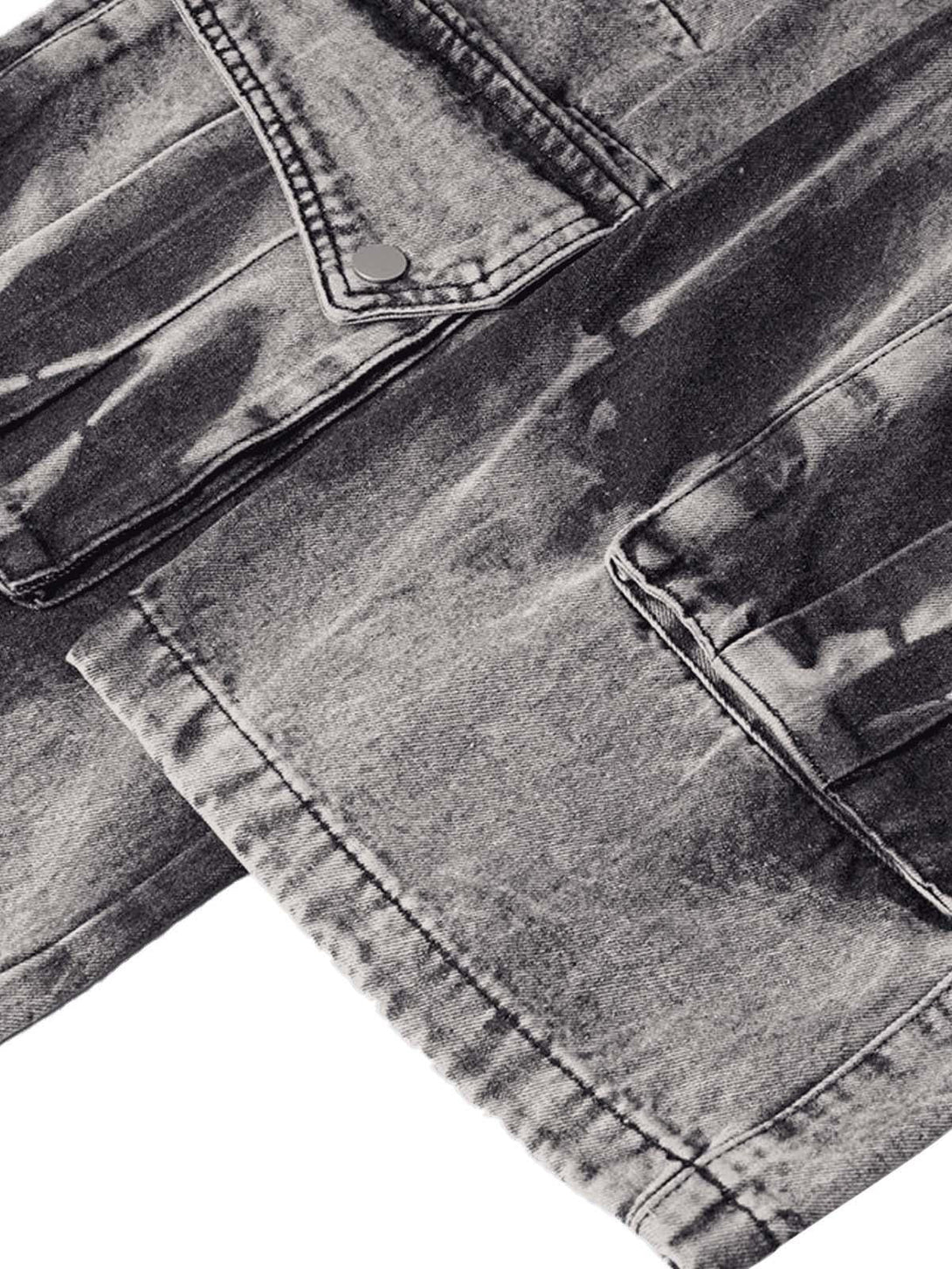 Zoomed-in texture of TALISHKO's washed distressed work jeans, showcasing pocket details.