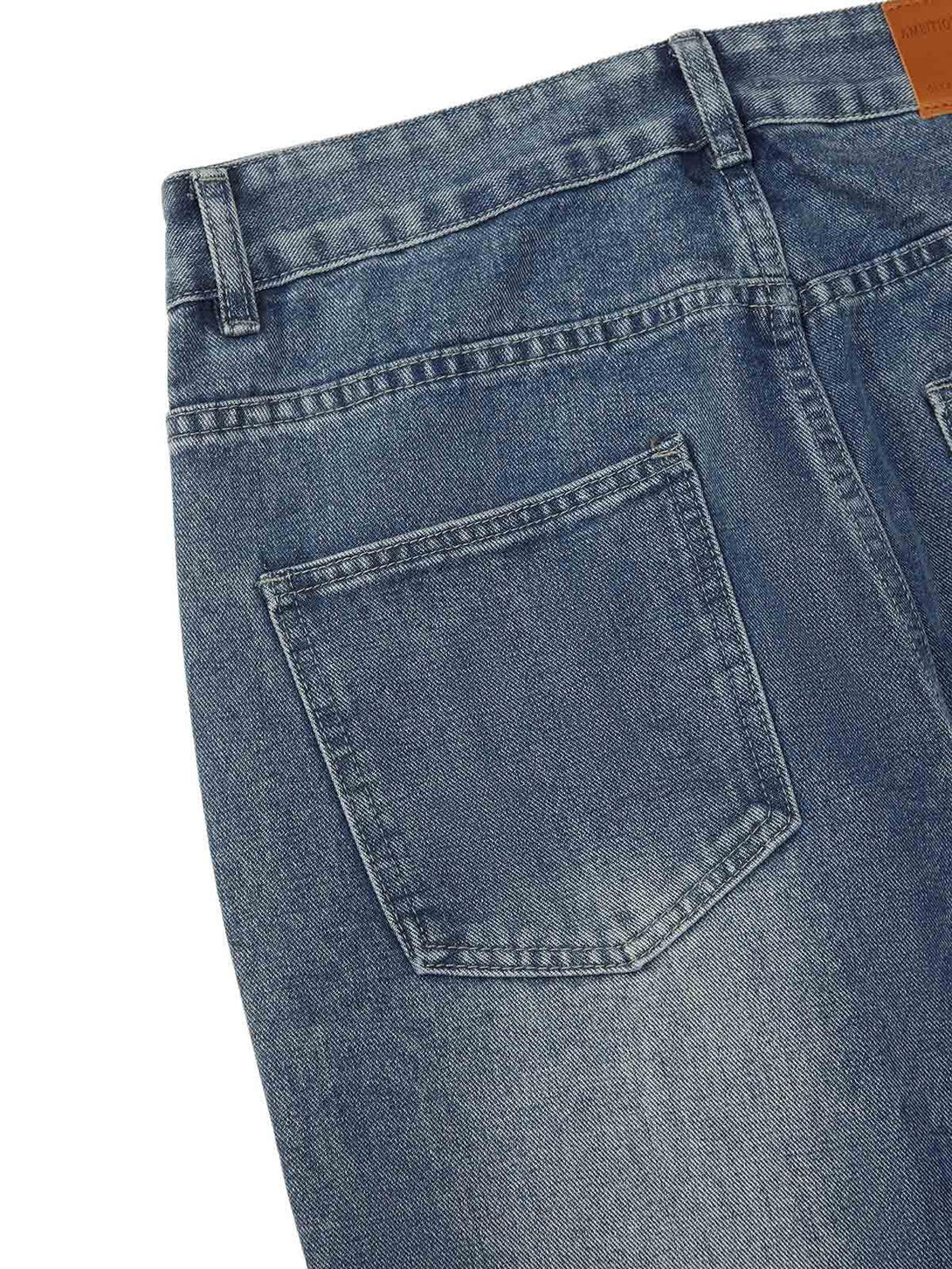 Detailed look at TALISHKO's washed denim, highlighting classic pocket design and texture.