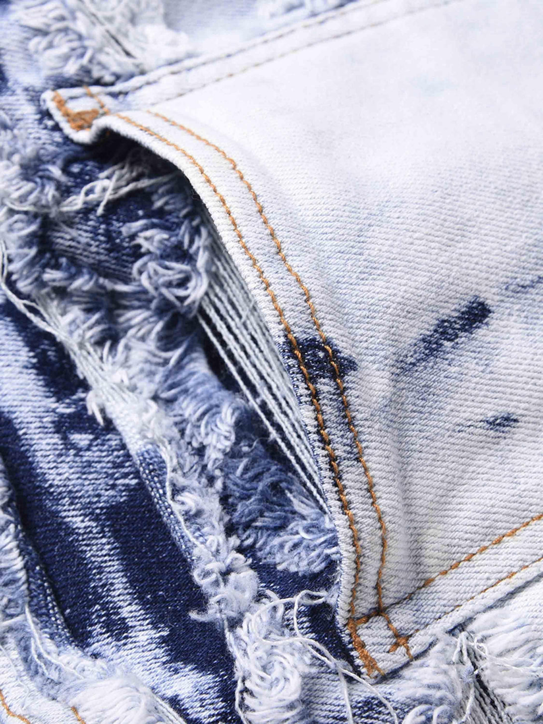Intricate texture and frayed details of TALISHKO high street washed slim fit jeans.
