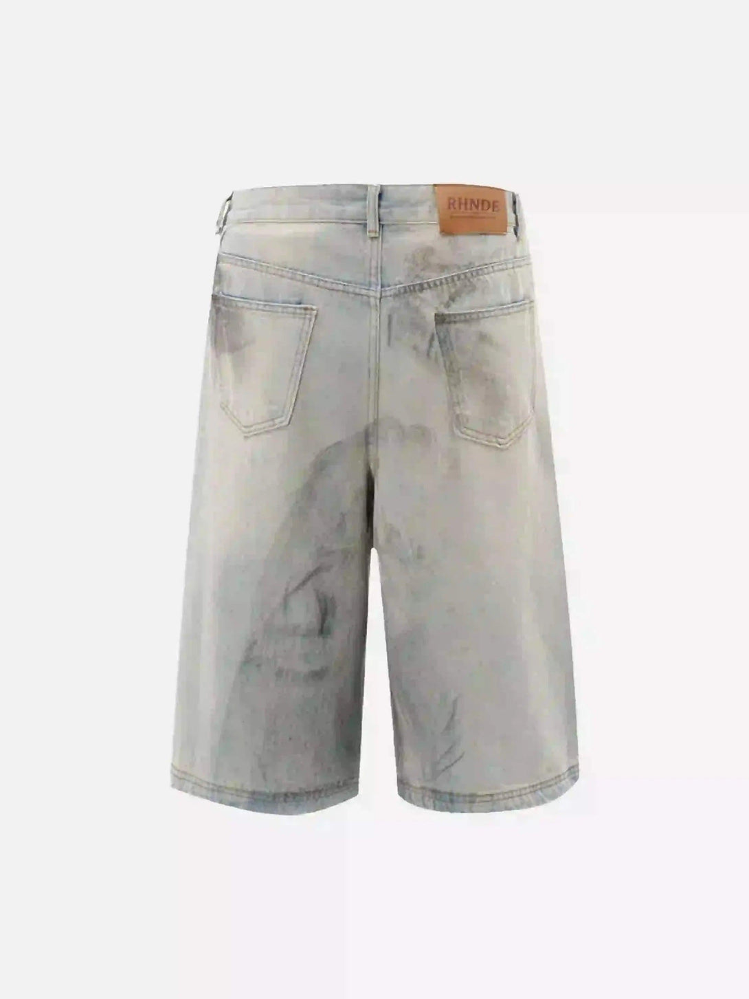 Back view of TALISHKO denim shorts with a distinct mud-dyed pattern and label accent.