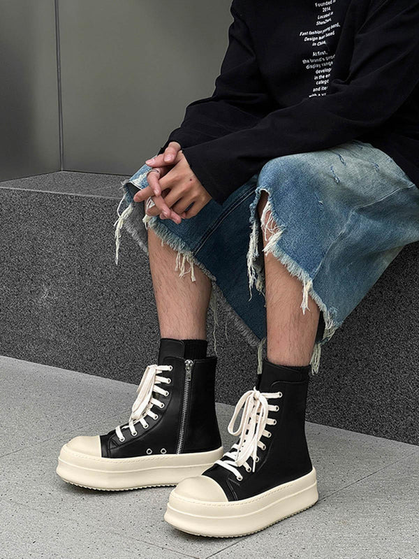 High-top side zipper platform sneakers by TALISHKO styled with distressed denim shorts.