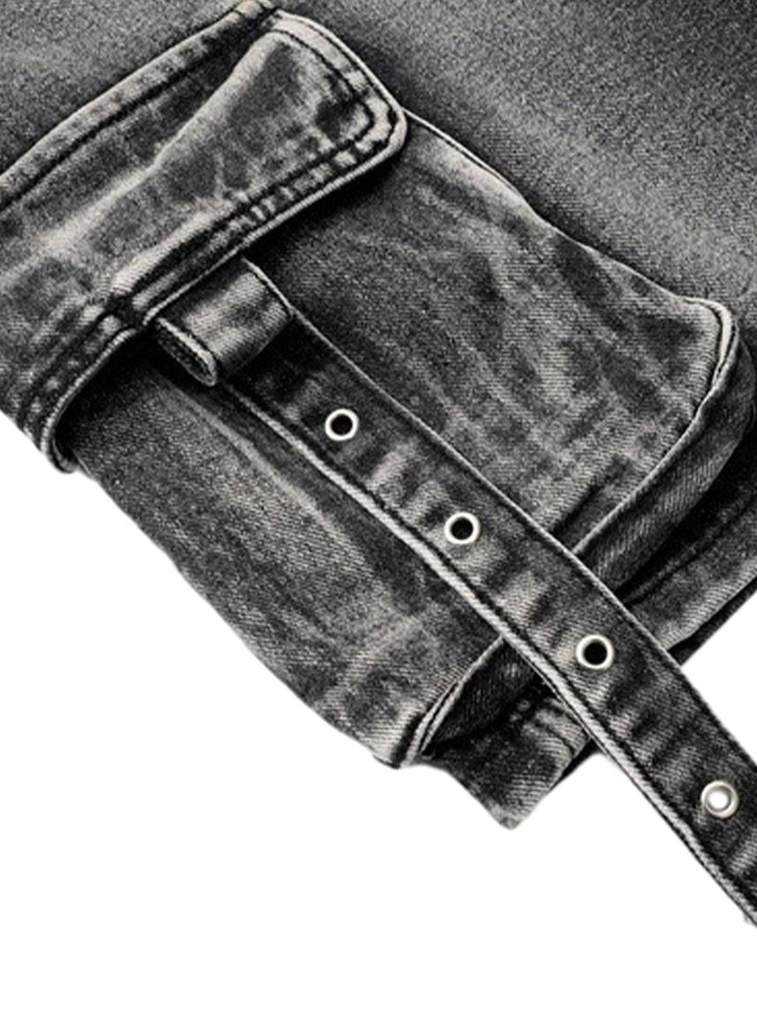 Intricate look at TALISHKO's denim cargo shorts, highlighting pocket design and grommet detail.