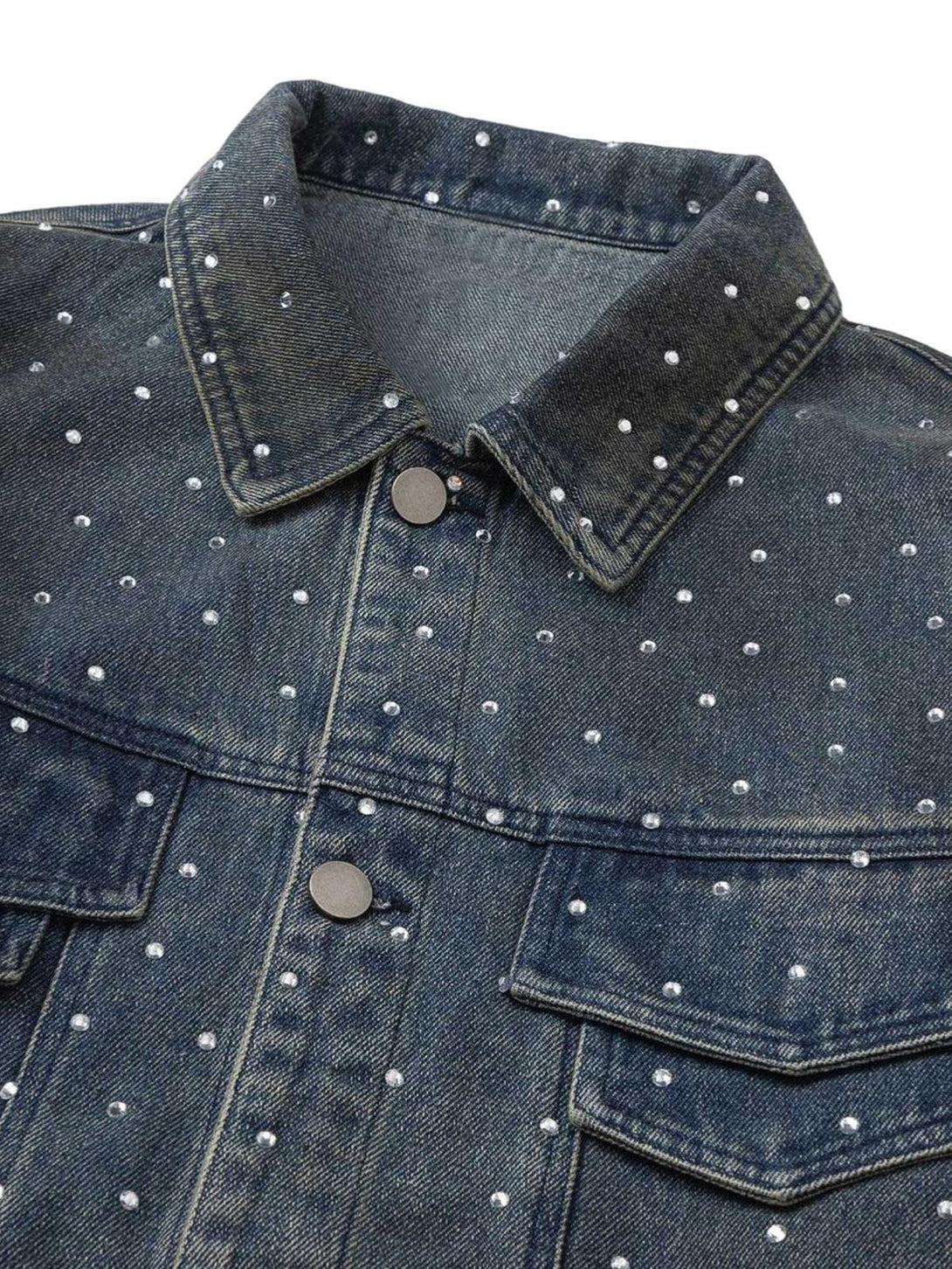 A close-up of TALISHKO's beaded denim jacket, highlighting intricate detailing and texture.