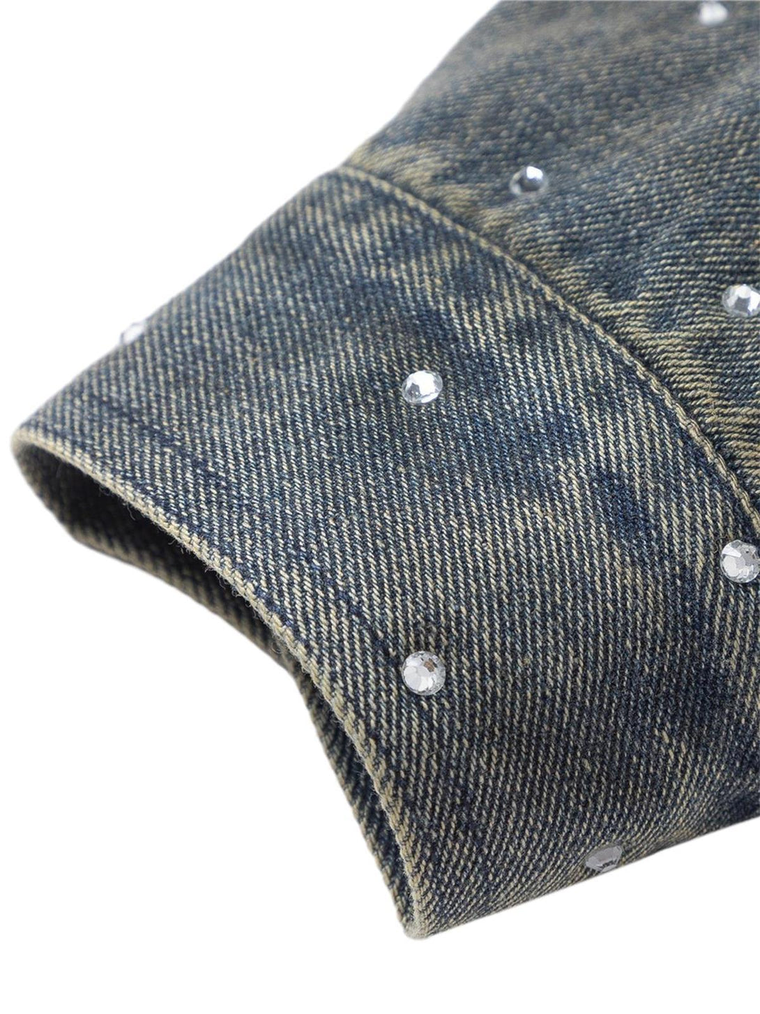 A sleeve detail of TALISHKO's denim jacket, featuring sparkling bead accents on washed fabric.