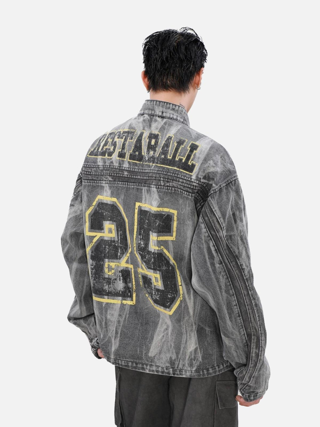 Back view of TALISHKO denim jacket showcasing large "25" print and distressed style.