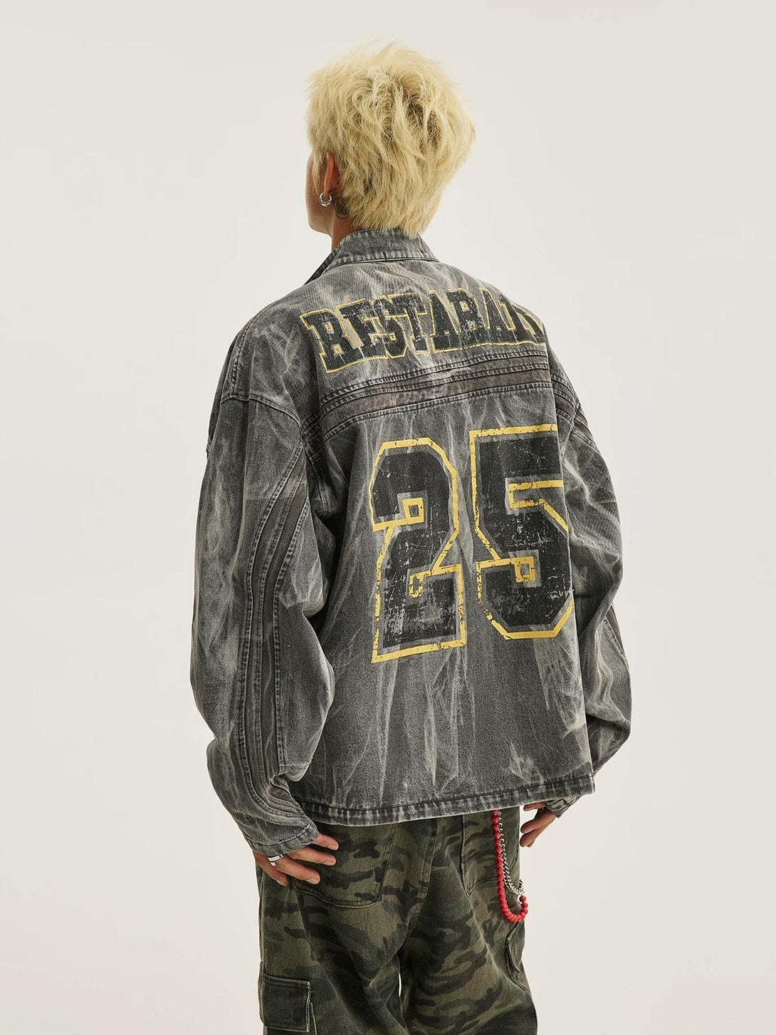 Back view of TALISHKO denim jacket featuring bold "25" print and distressed wash style.