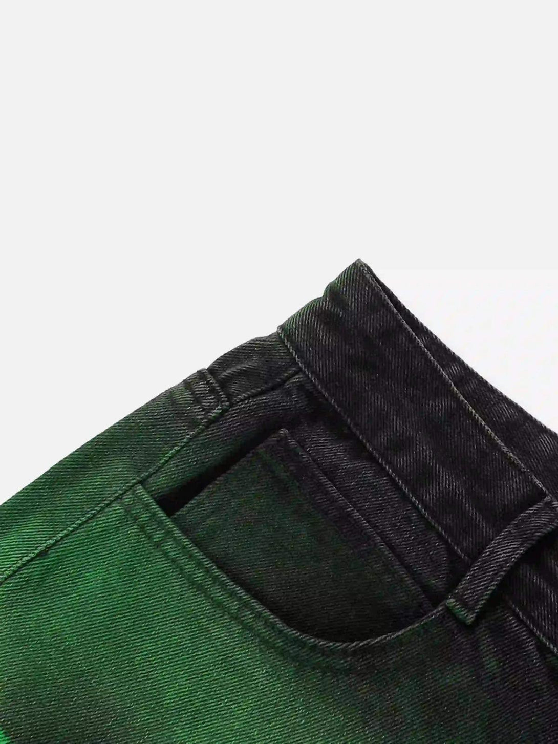 A detailed view of TALISHKO's hip-hop jeans, showcasing green hand-painted pocket detail.