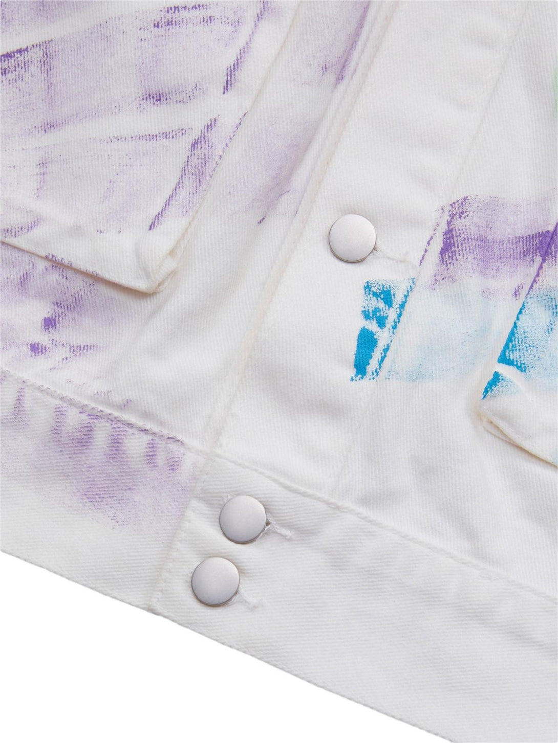 TALISHKO's graffiti denim jacket detail with hand-painted colors and silver button accents.