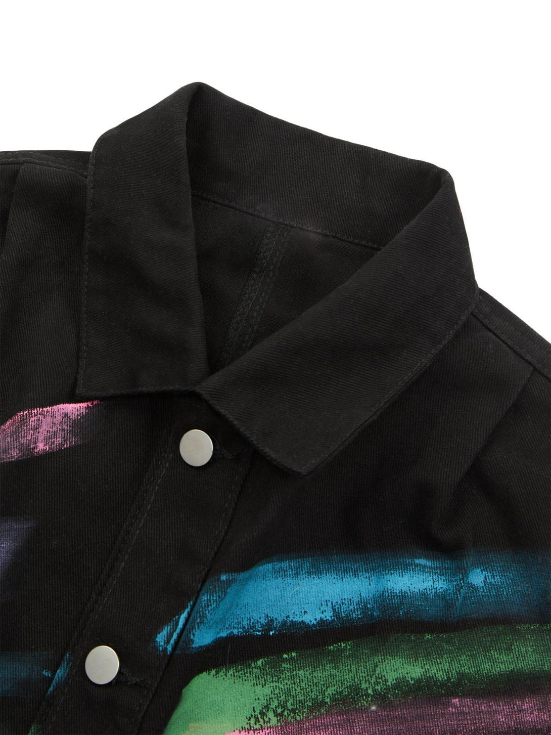 Detailed fabric and stitching of TALISHKO's graffiti denim jacket with bold, colorful patterns.