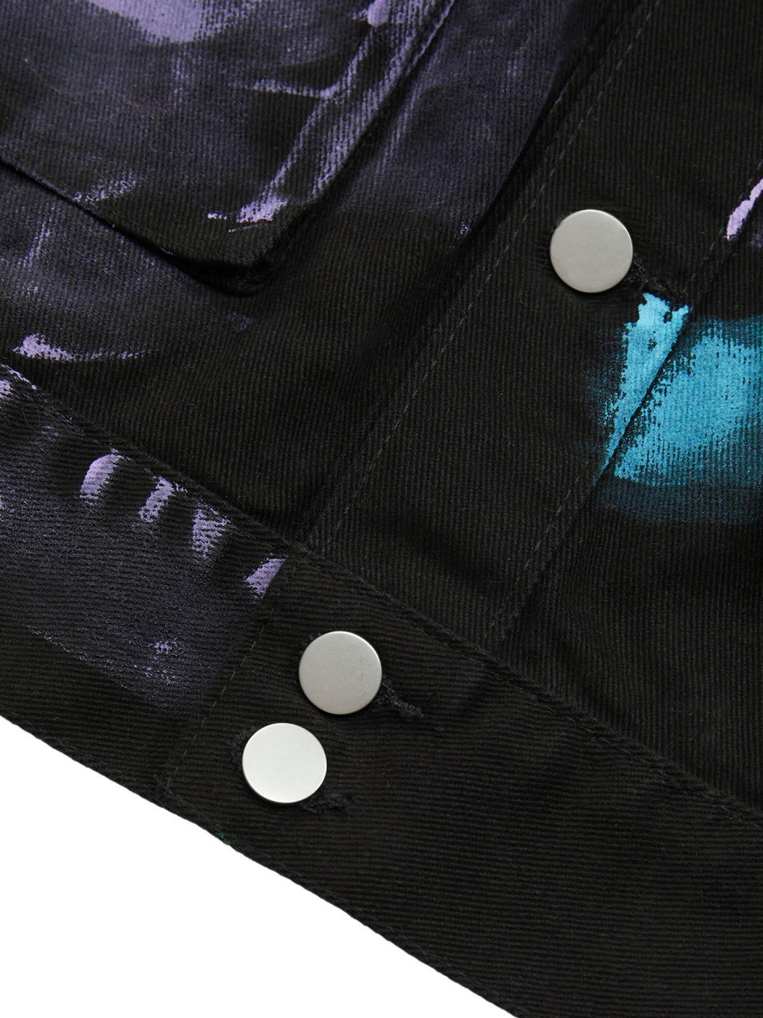 Intricate look at TALISHKO graffiti denim jacket with bold hand-painted details and silver buttons.