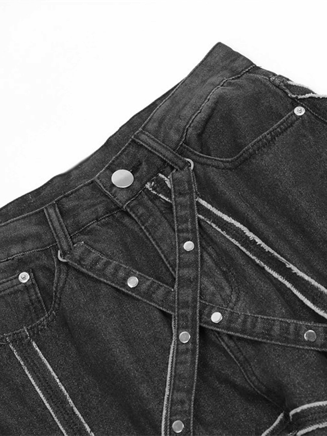 Focusing on the intricate spider web design and rivet details of TALISHKO hip-hop jeans.