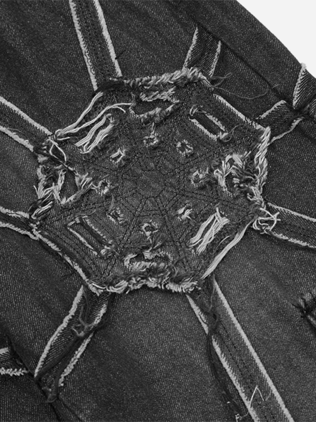 Intricate look at the spider web pattern on TALISHKO hip-hop jeans, showcasing edgy style.