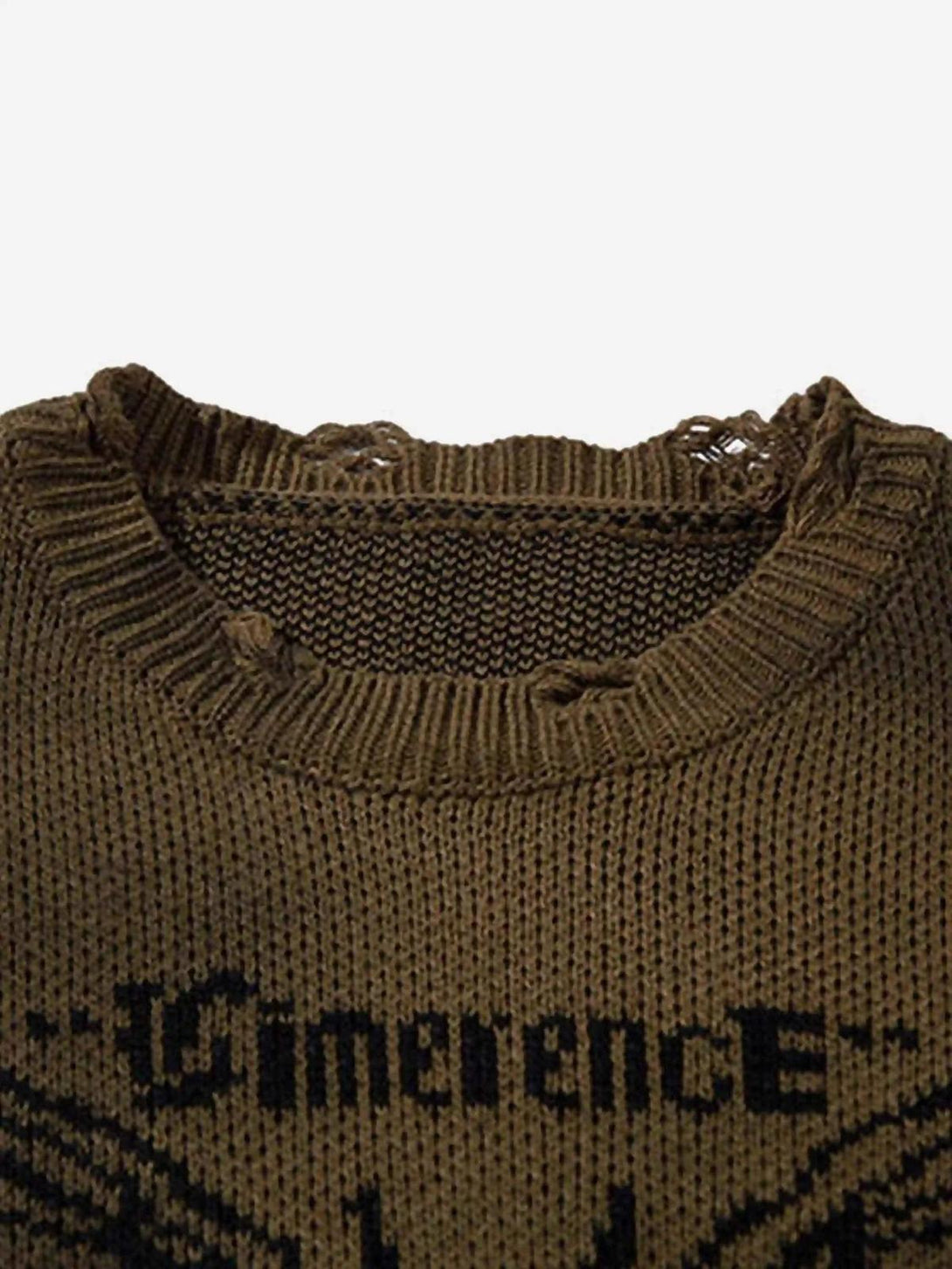 A close-up of TALISHKO sweater's neckline, highlighting the intricate jacquard and distressed details.