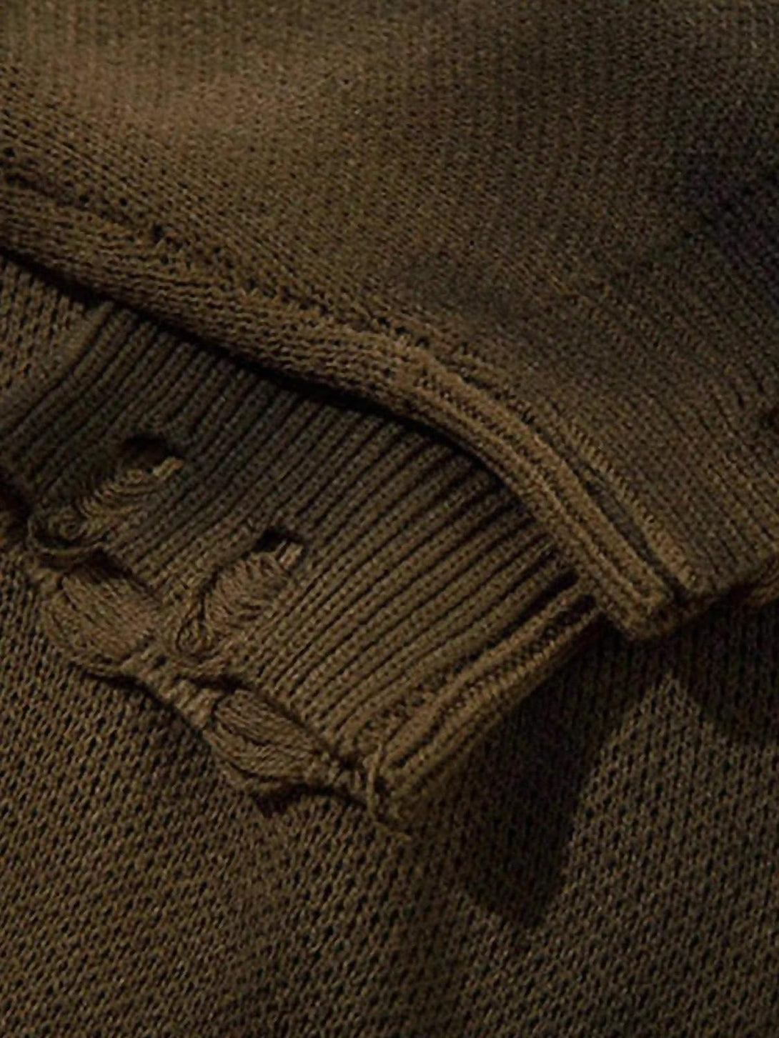 Zoomed-in texture of TALISHKO sweater, highlighting intricate knit and distressed details.