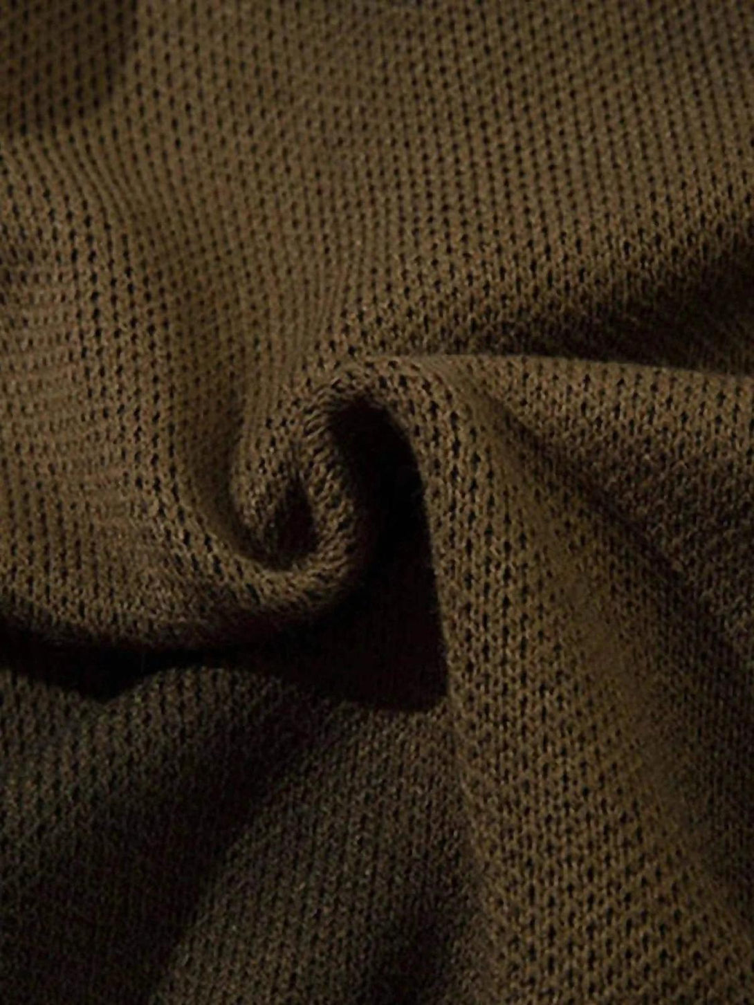 Intricate knit texture of TALISHKO sweater, highlighting its unique weave and cozy feel.