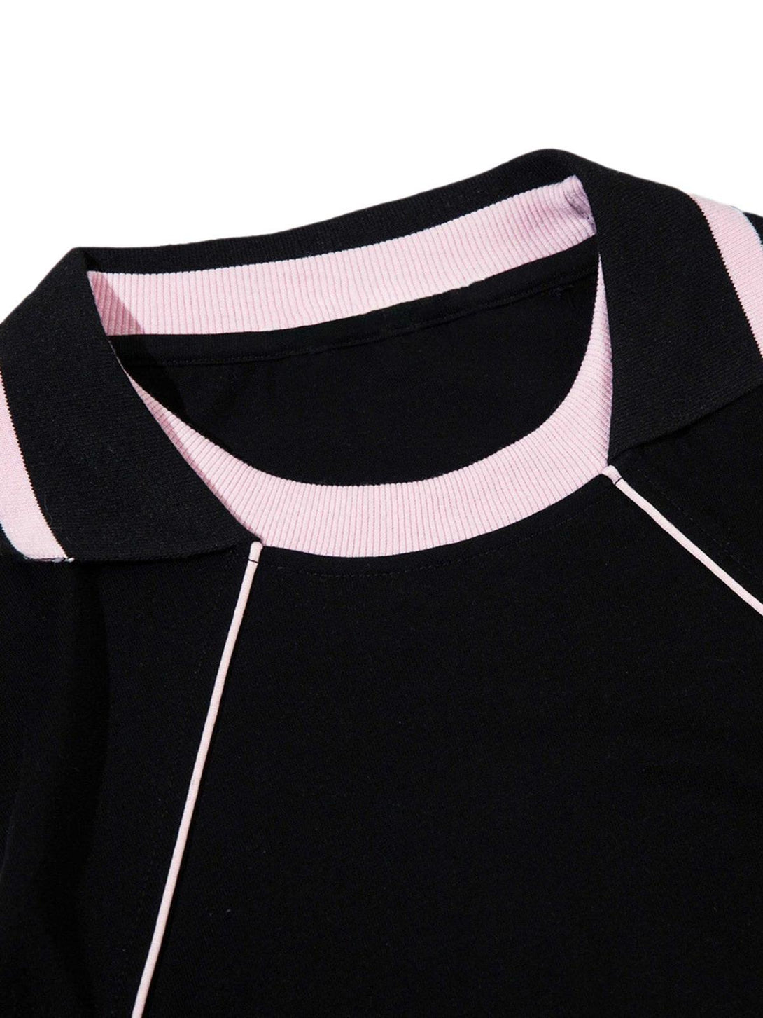 Focusing on the collar detail, this TALISHKO T-shirt blends black and pink for a trendy look.