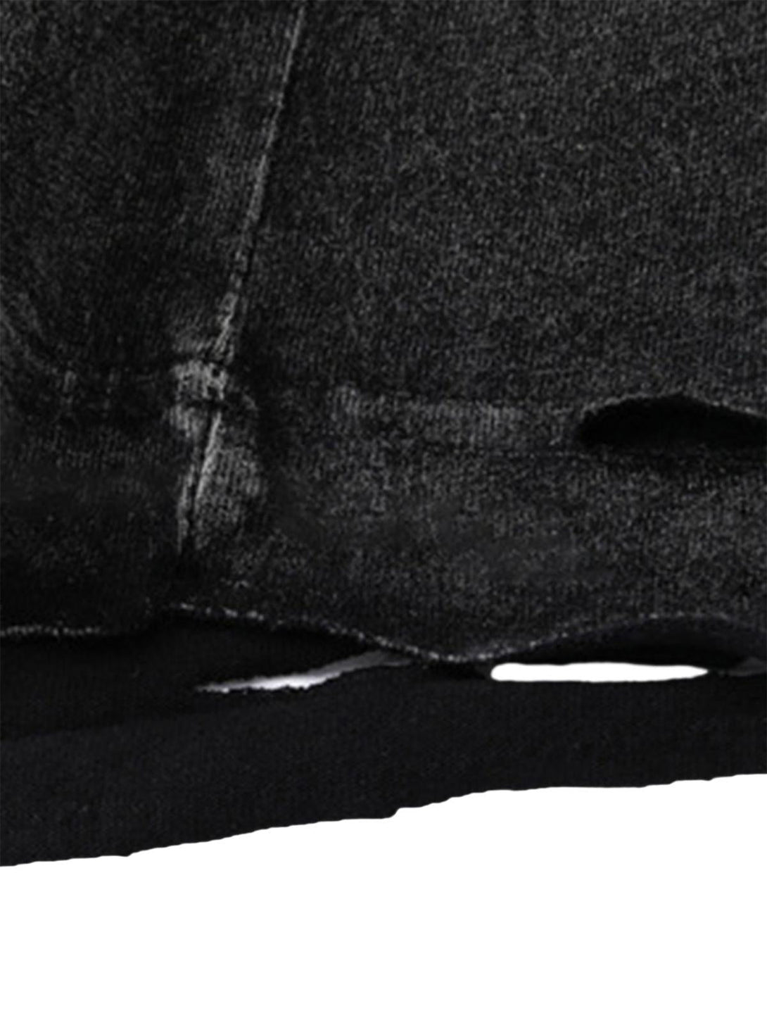 A close-up of TALISHKO's hip-hop undershirt, highlighting the washed texture and distressed hem.