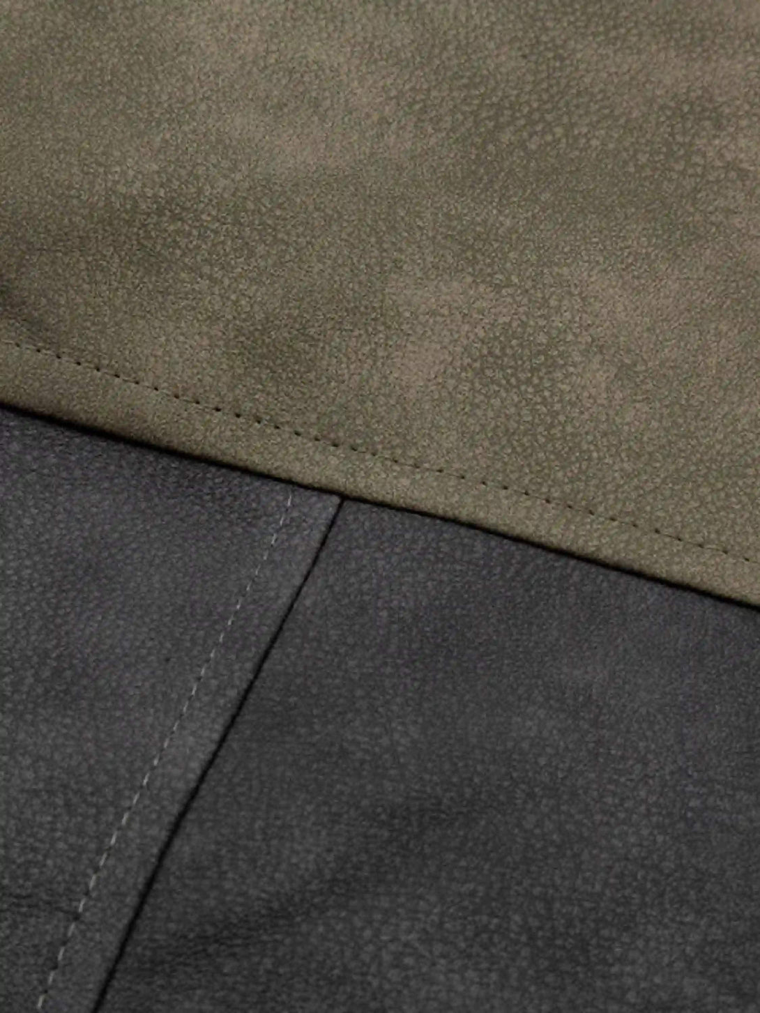 Intricate look at the fabric contrast in a hip-hop motorcycle jacket by TALISHKO.