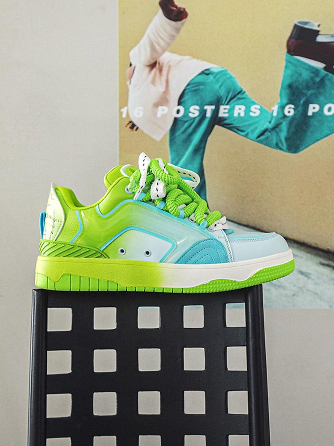 TALISHKO skateboard shoes in vibrant green and blue, elegantly displayed on a modern chair.