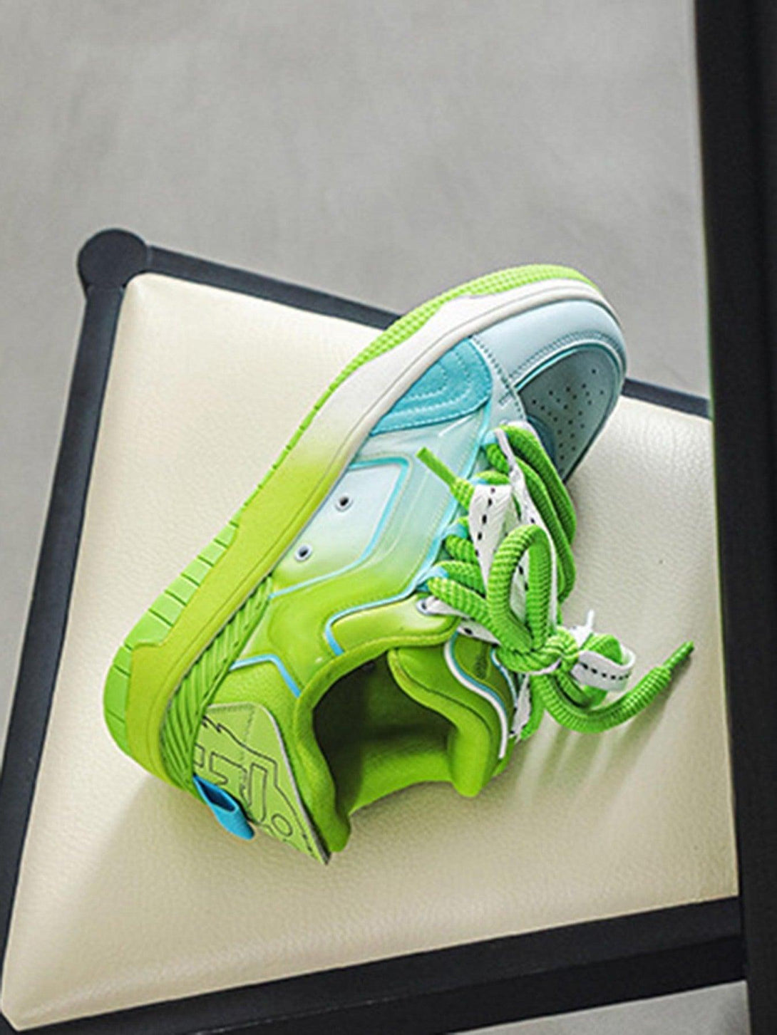 TALISHKO hip-hop skateboard shoes in green and blue, featuring bold laces and a vibrant style.