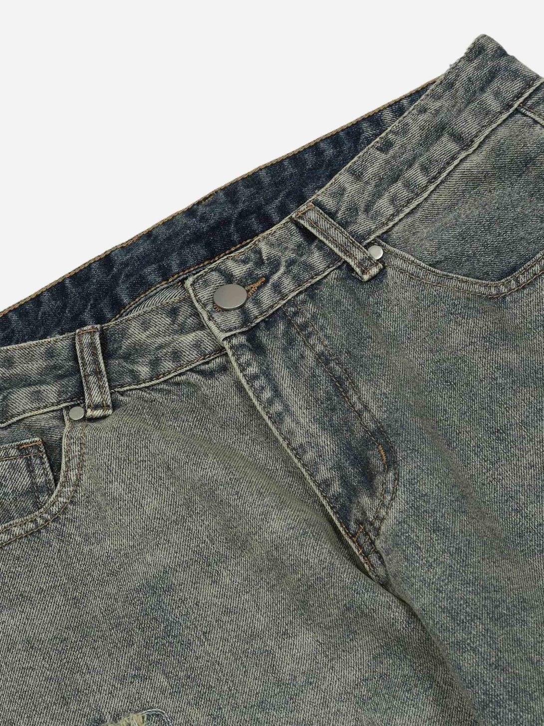 Detailed fabric and stitching on TALISHKO's hip hop retro denim jeans, highlighting a vintage vibe.