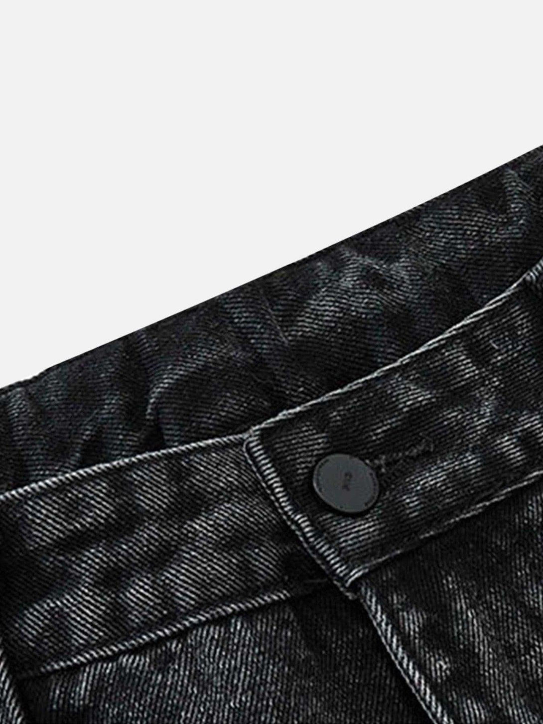 Detailed view of TALISHKO hip-hop retro wash denim pants, highlighting the textured fabric.
