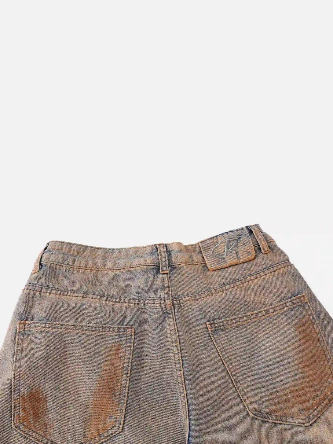 Back view of TALISHKO hip-hop jeans, highlighting mud-dyed texture and pocket detail.