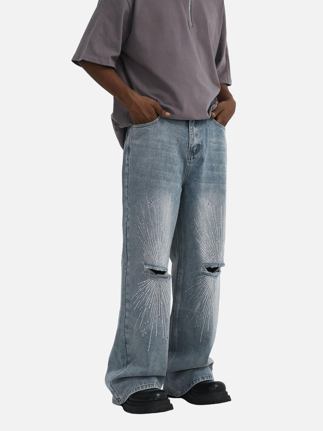 Model wearing TALISHKO distressed baggy jeans with sparkling diamond designs and a casual fit.