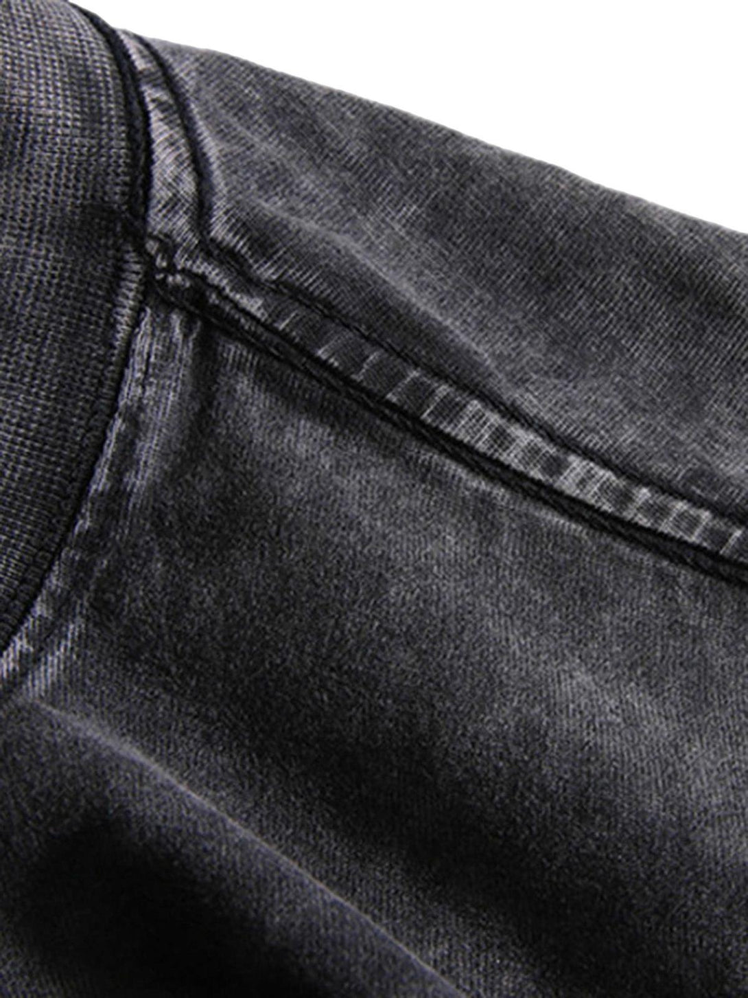 A detailed view of the rugged fabric and stitching on TALISHKO's hip hop T-shirt.