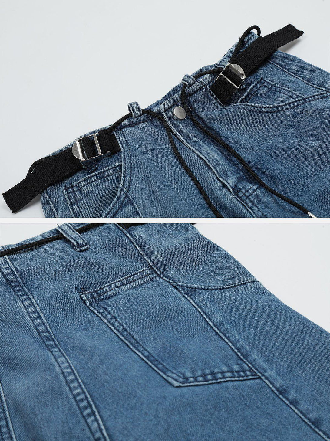 Detailed view of TALISHKO hip hop jeans, highlighting strap details and denim texture.