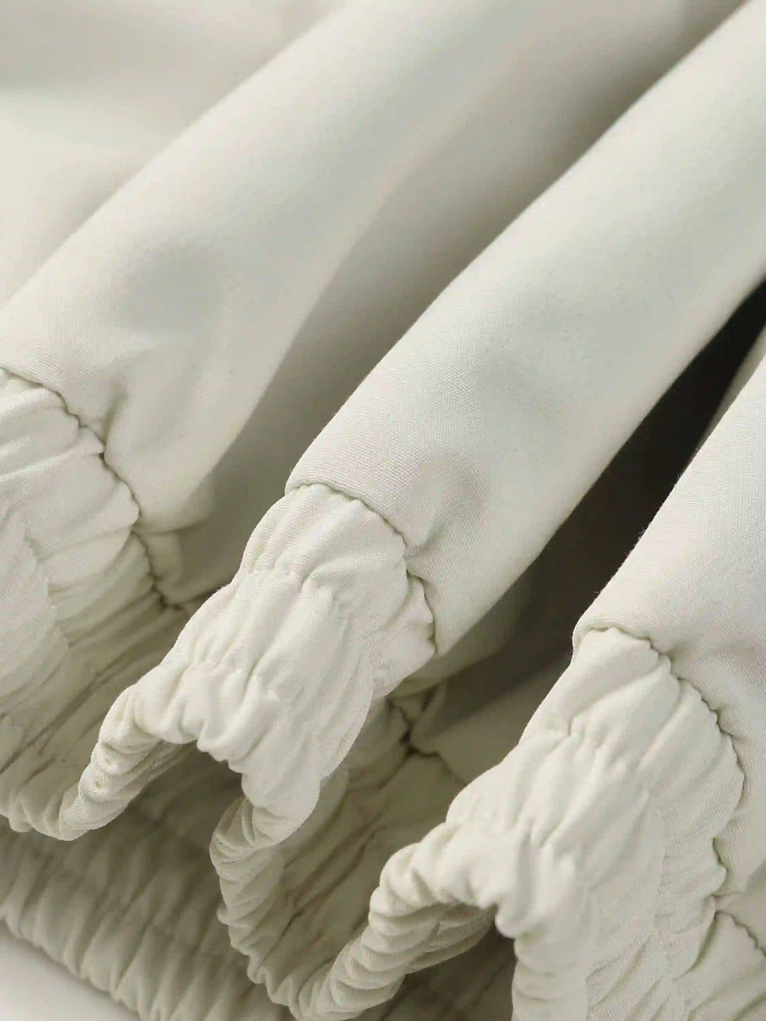 A detailed view of elastic cuffs on a TALISHKO jacket, showcasing its stylish craftsmanship.